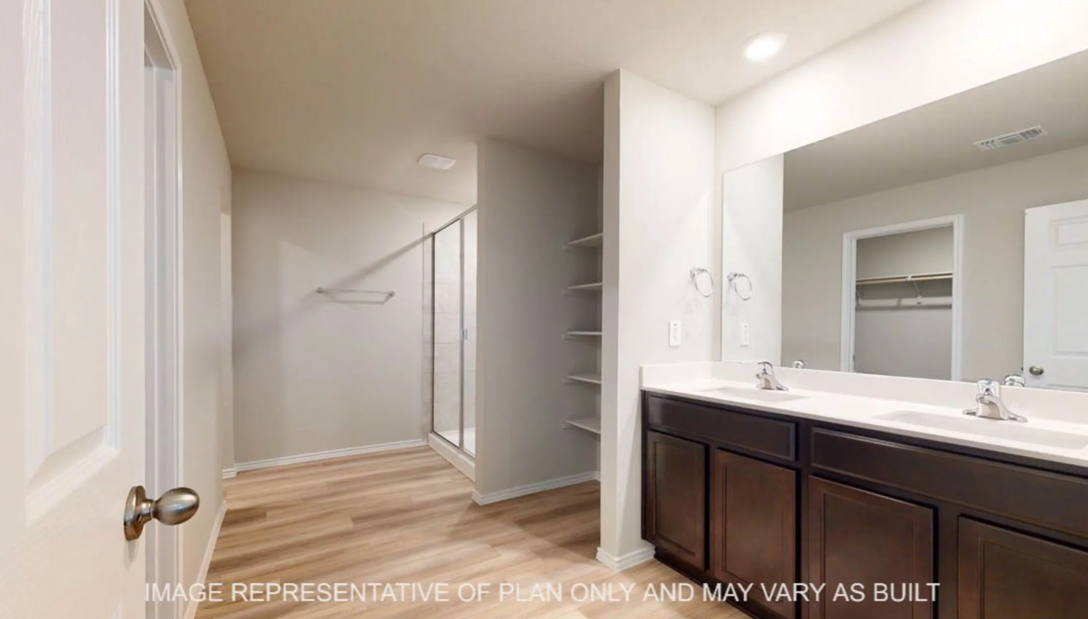 Dual vanity with dark wood-finish cabinetry, white countertop, and integrated sinks