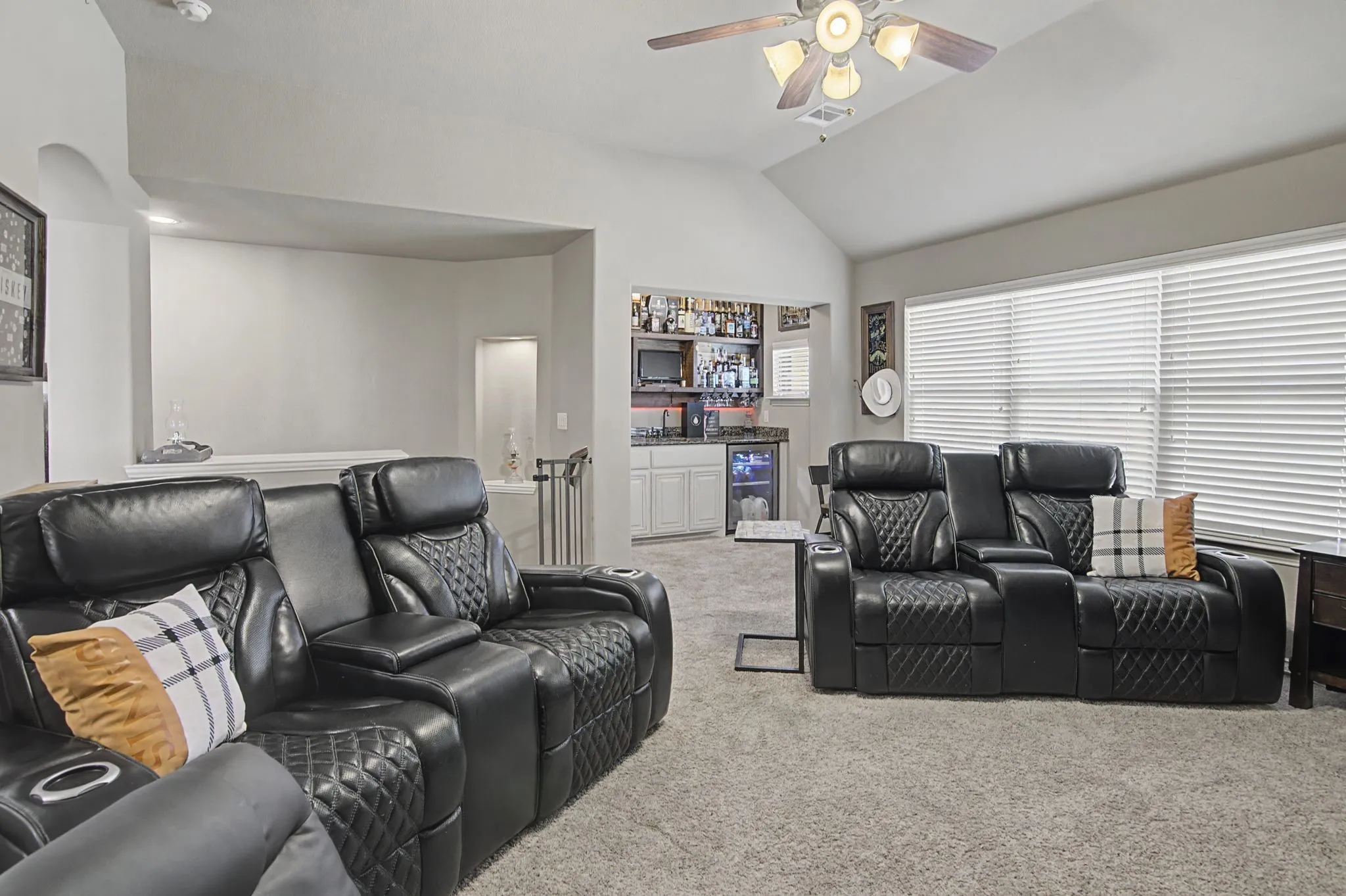 At the rear of the upstairs living space is a built-in bar.  Great spot for entertaining.  A mancave, a game room, an extra living room...what do you need??