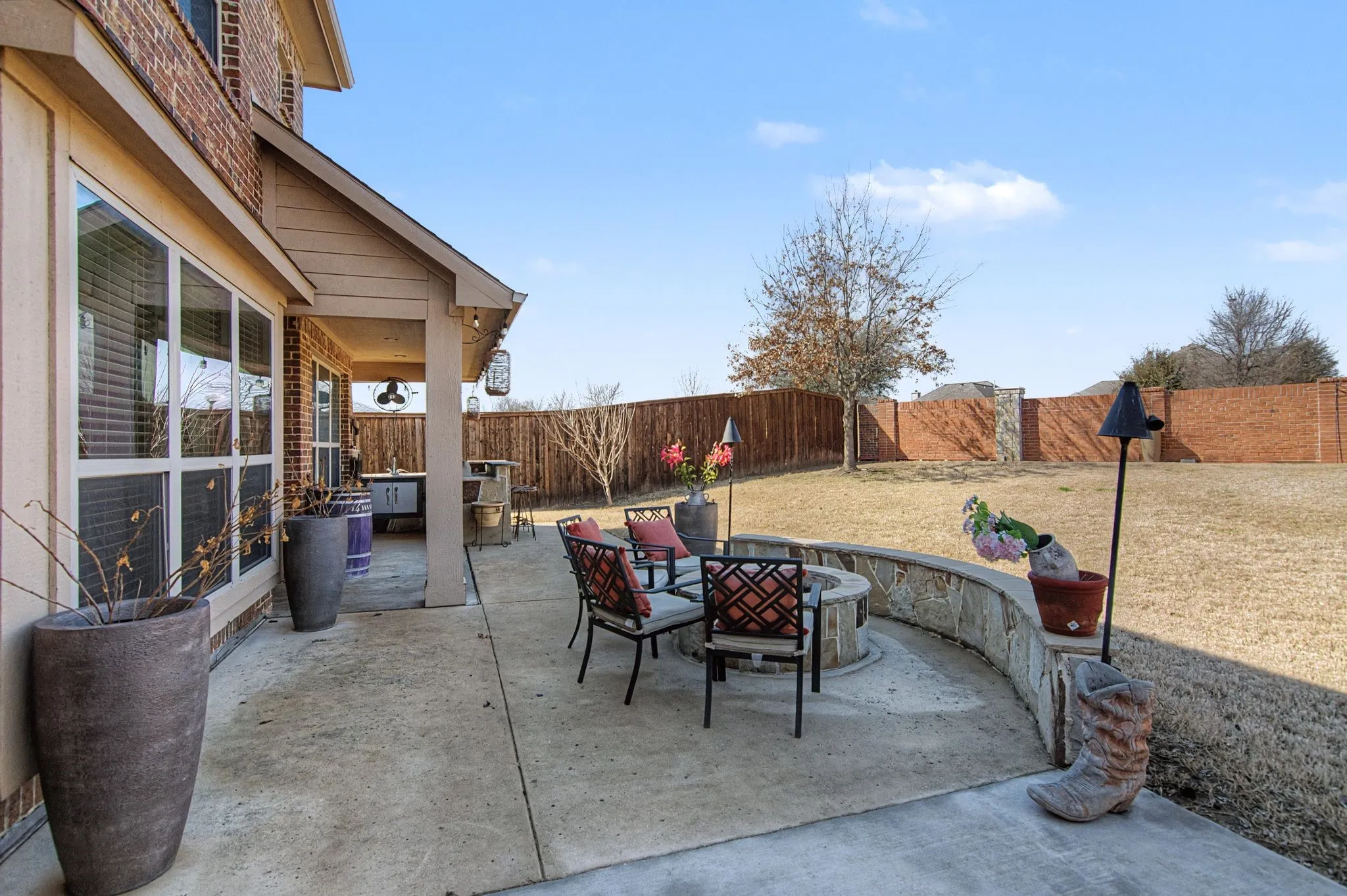 This oversized backyard has enough room for this beautiful patio with outdoor kitchen and fire pit.  Tons of yard still left for fun.  No homes behind and 8ft fence on the sides.  Very private yard to enjoy!