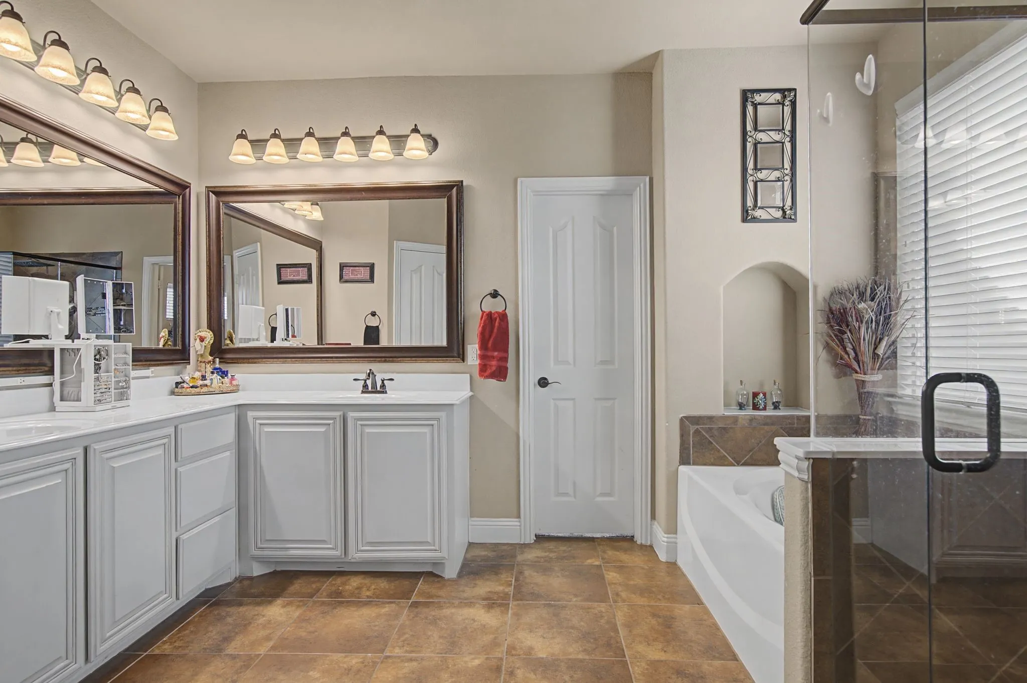 Dual vanities, separate tub and shower and a giant walk-in closet