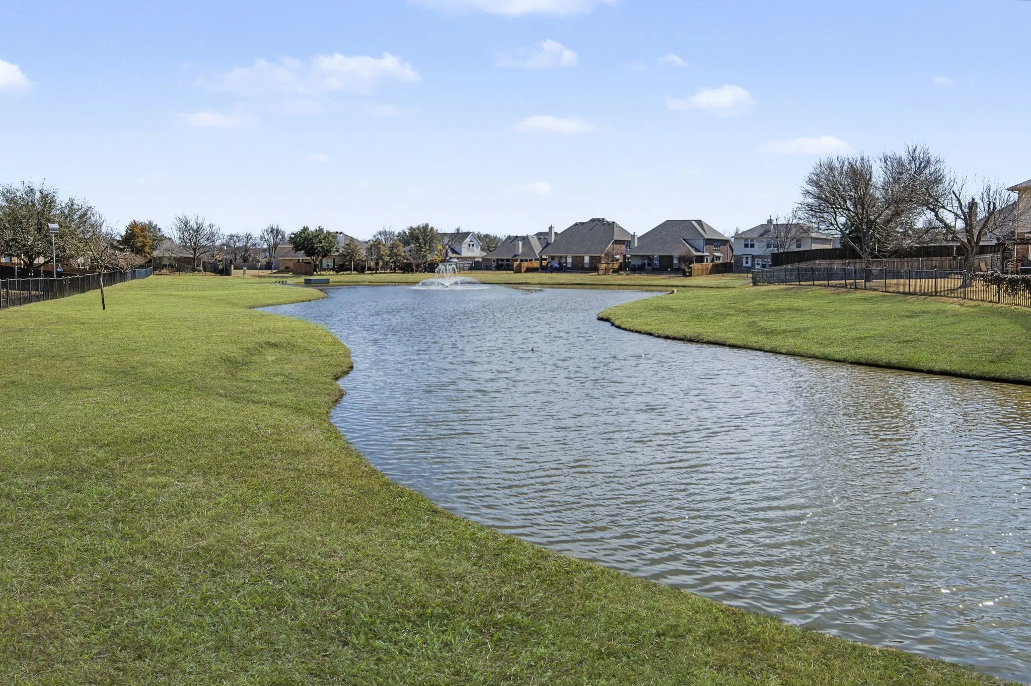 This greenspace is across the street from your new home at 5728 Brookside! Walk across the street to enjoy this beautiful pond.  Photo has been digitally updated to include green grass