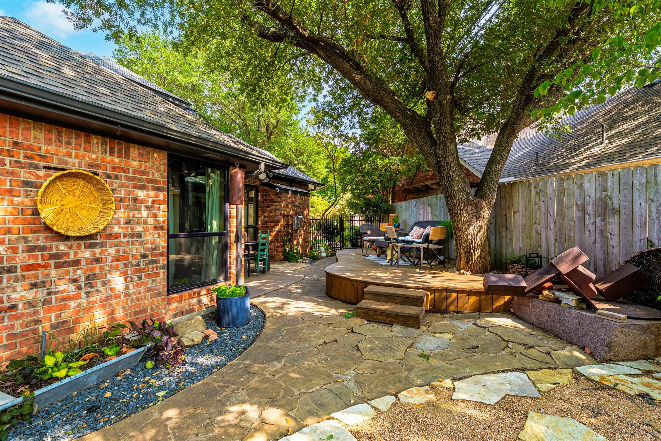 Charming brick cottage with mature shade trees and thoughtfully designed outdoor entertaining space