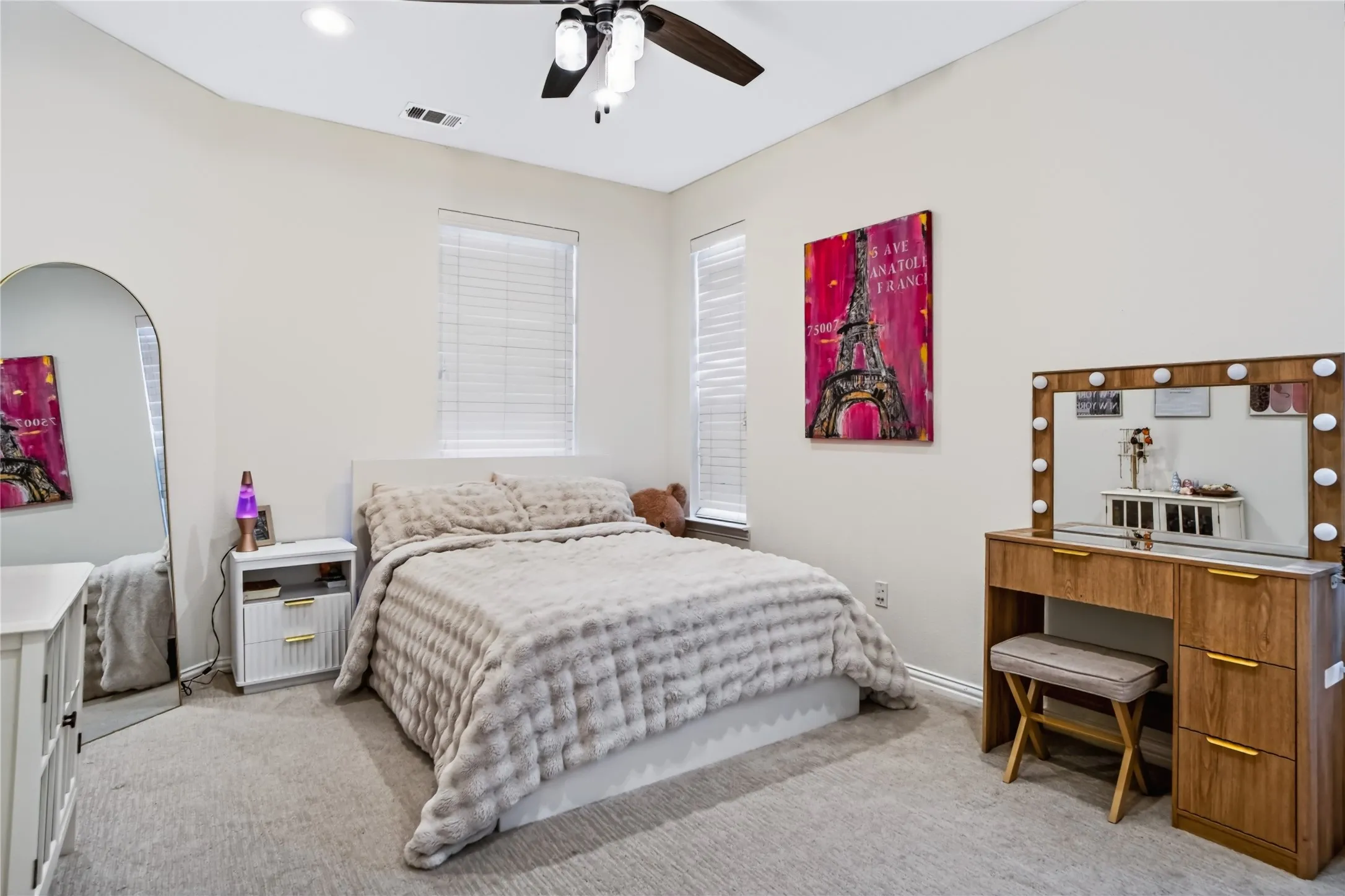 Recessed lighting, ceiling fan with light fixture, carpeted flooring, and multiple windows with blinds