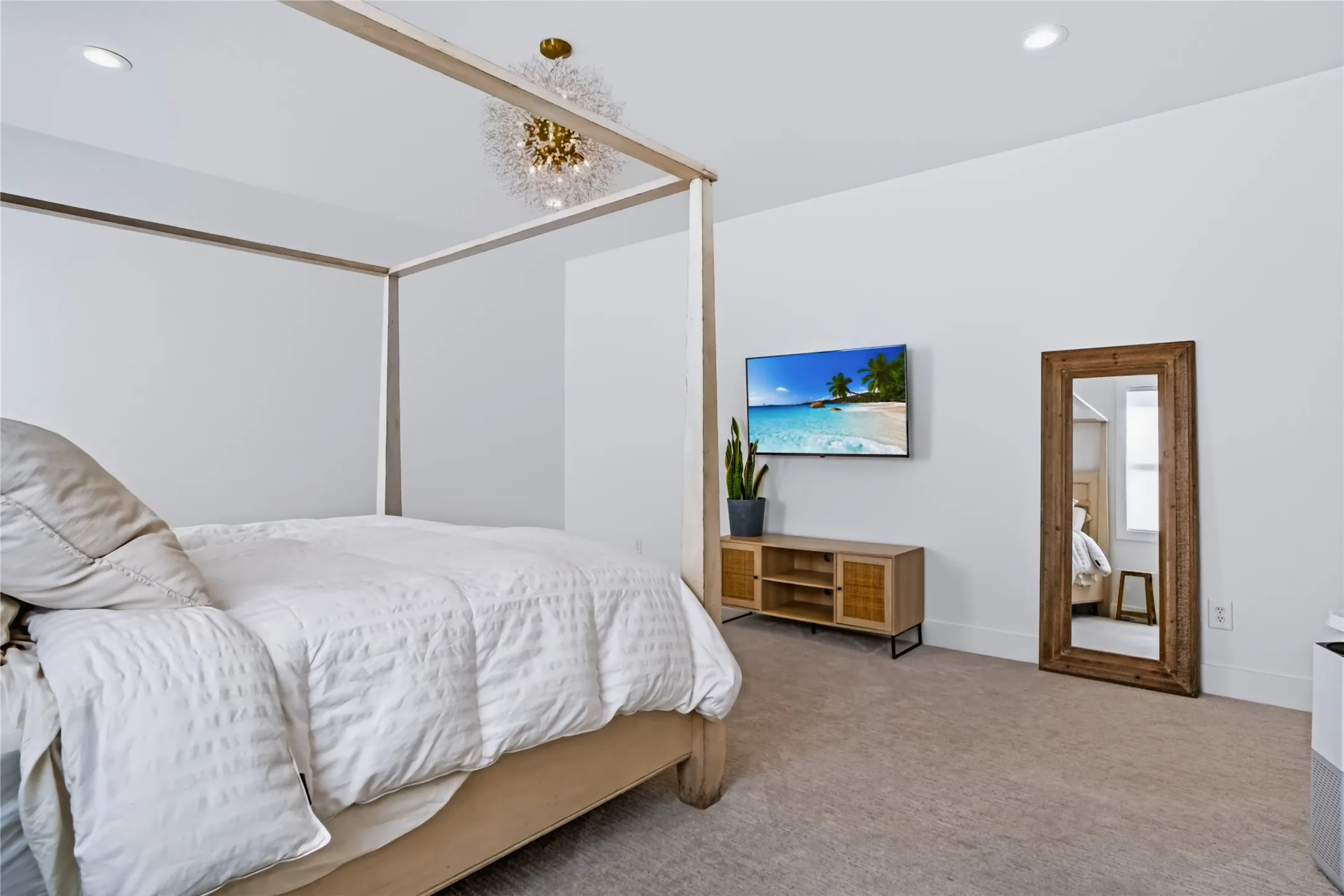 Recessed ceiling lighting complements the central fixture