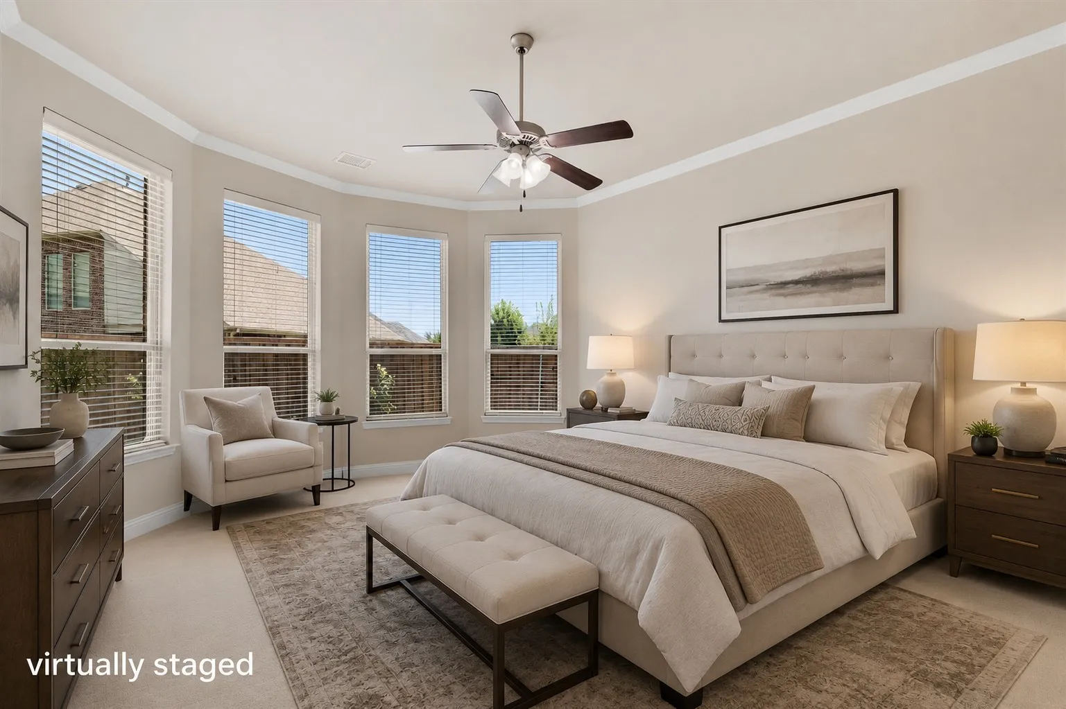 Tray ceiling with crown molding, multiple windows, ceiling fan, and carpeted flooring