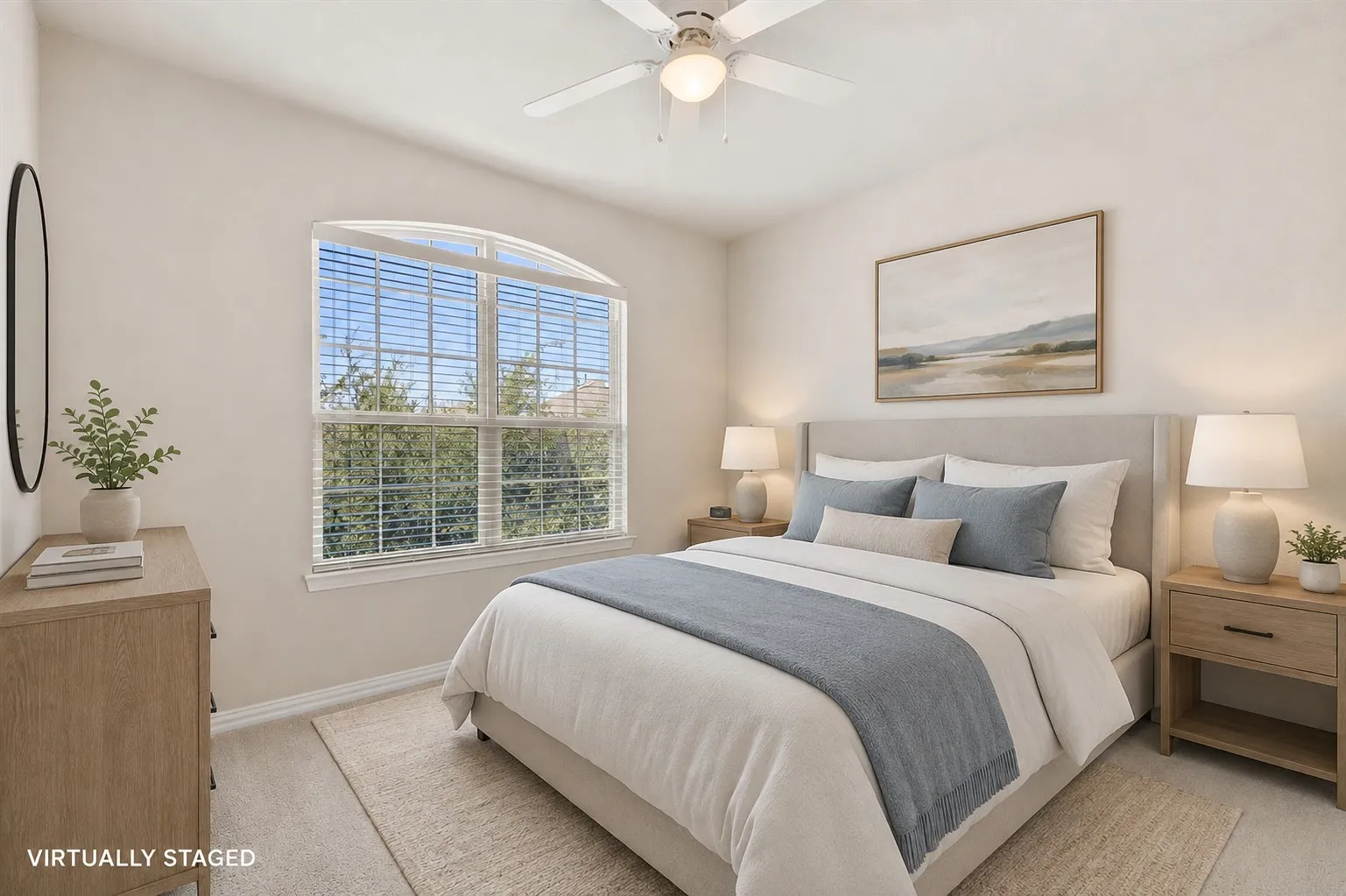 Room featuring an arched window, ceiling fan with integrated lighting, and neutral wall tones