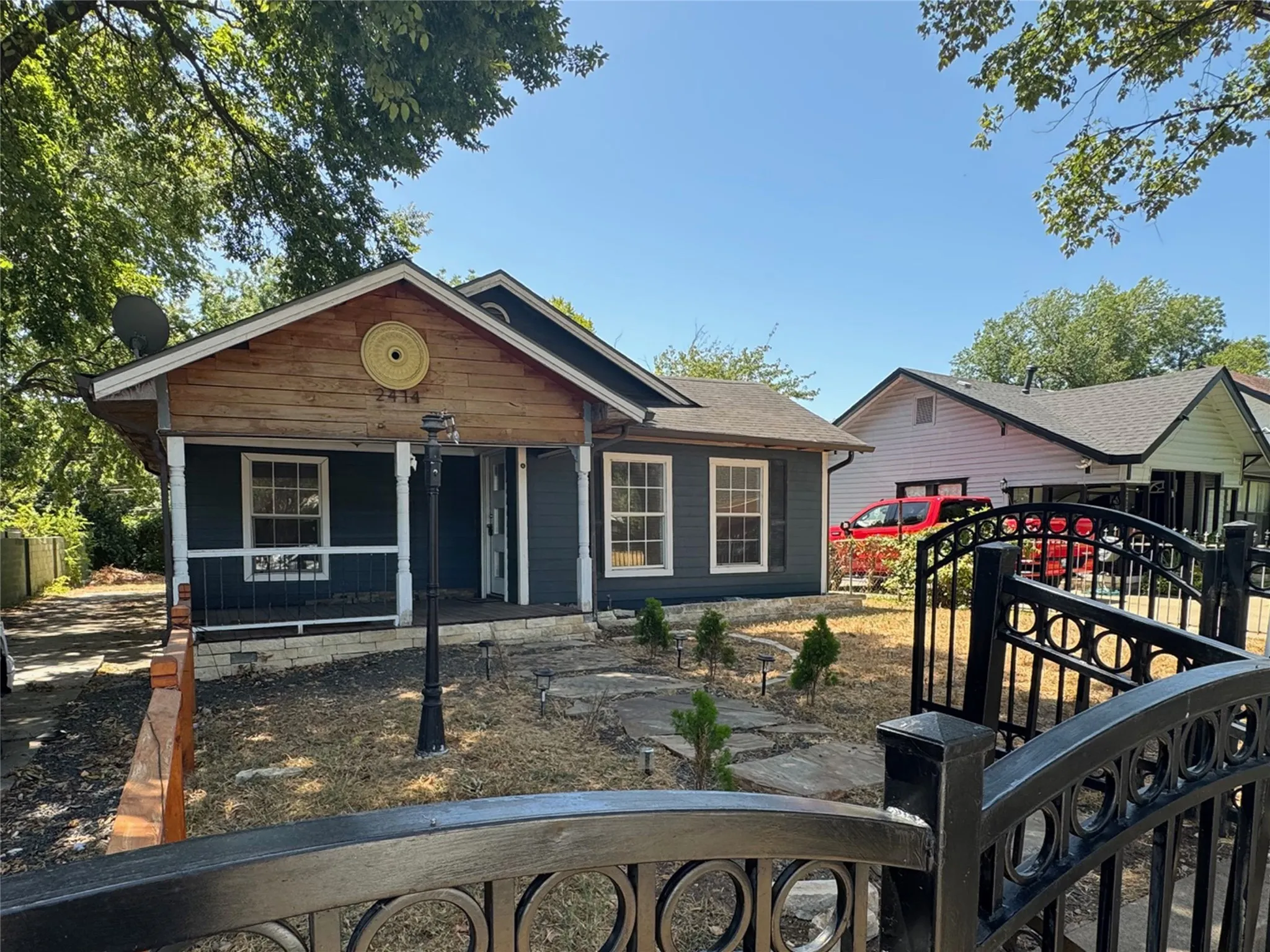 Curved metal fence around front