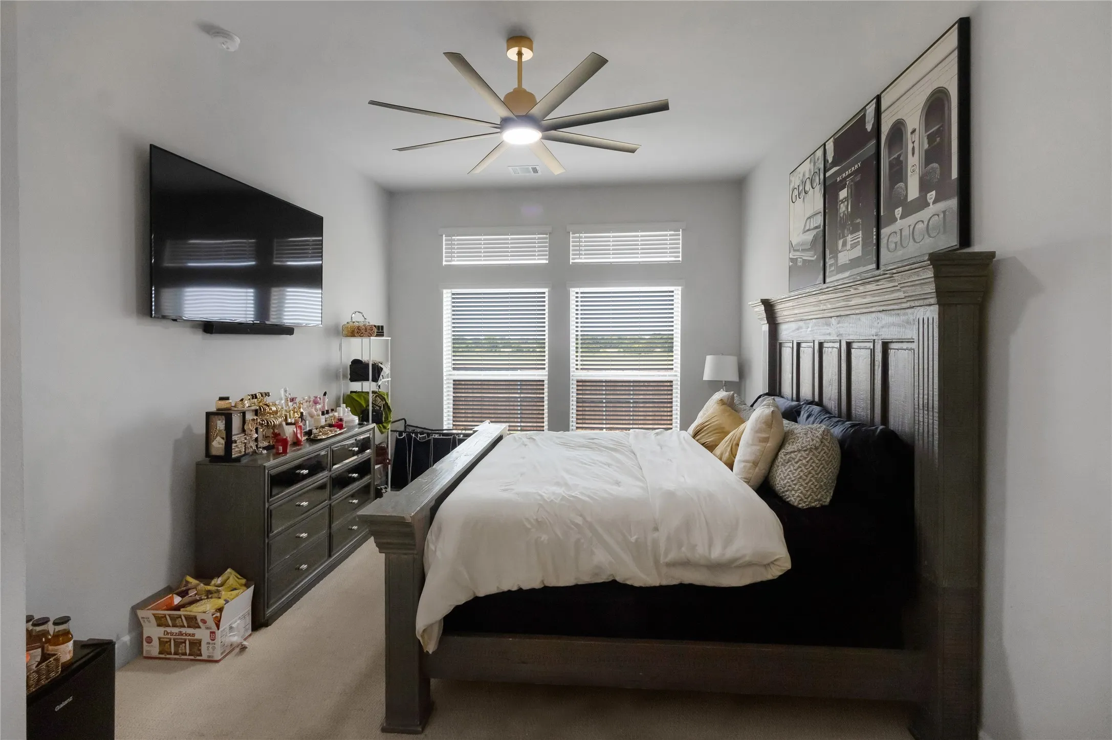 Spacious room featuring neutral carpeting and light gray wall paint