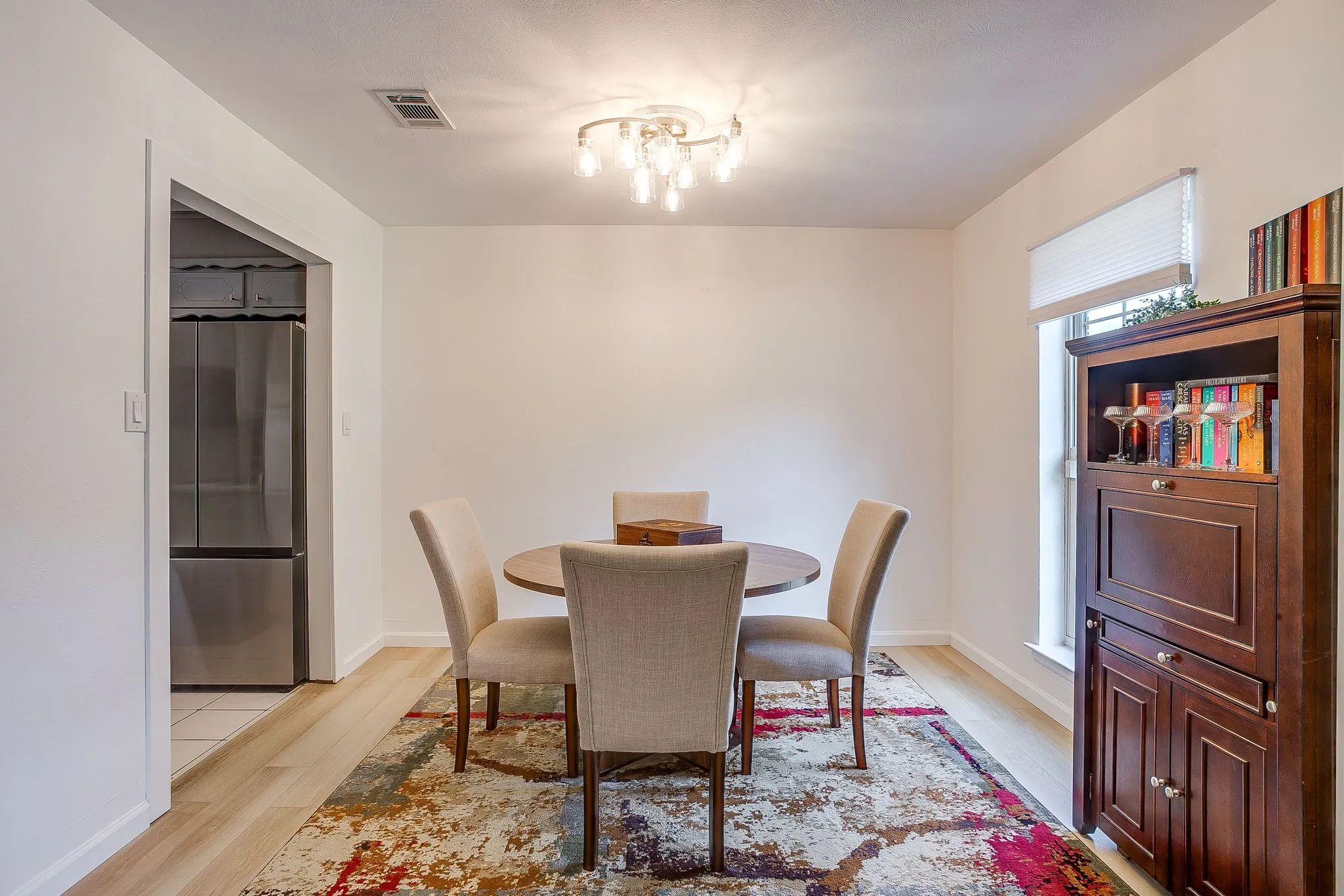Wood-finish flooring with white baseboards