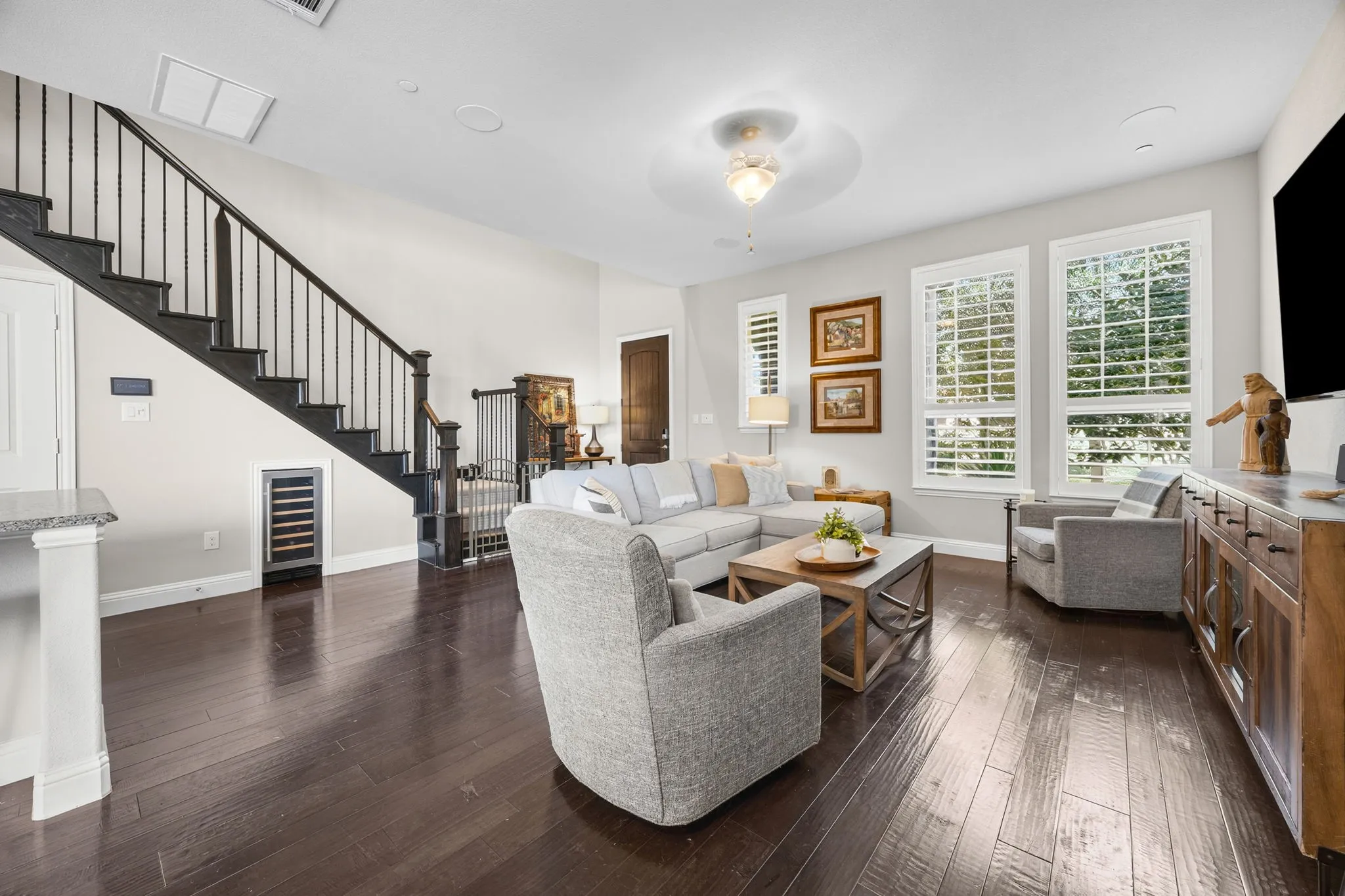 Check out wine fridge tucked under stairs!