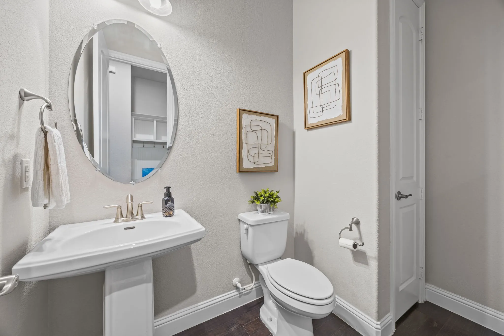 Half bathroom on 1st floor with large linen closet