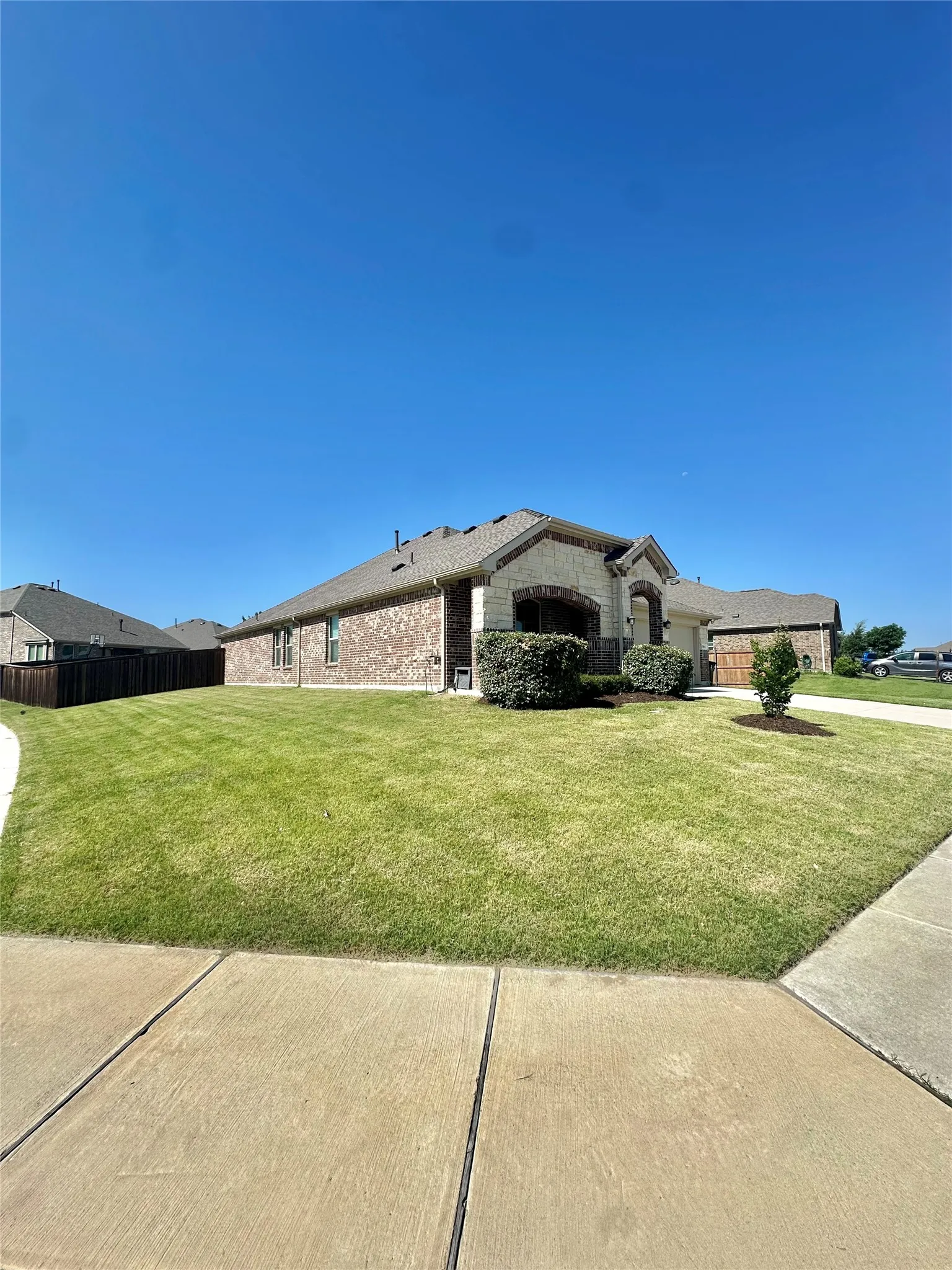 Perfectly positioned on a premium oversized corner homesite, this attractive brick-and-stone home offers outstanding curb appeal, architectural charm, and expansive outdoor space, making it one of the neighborhood's most desirable settings.