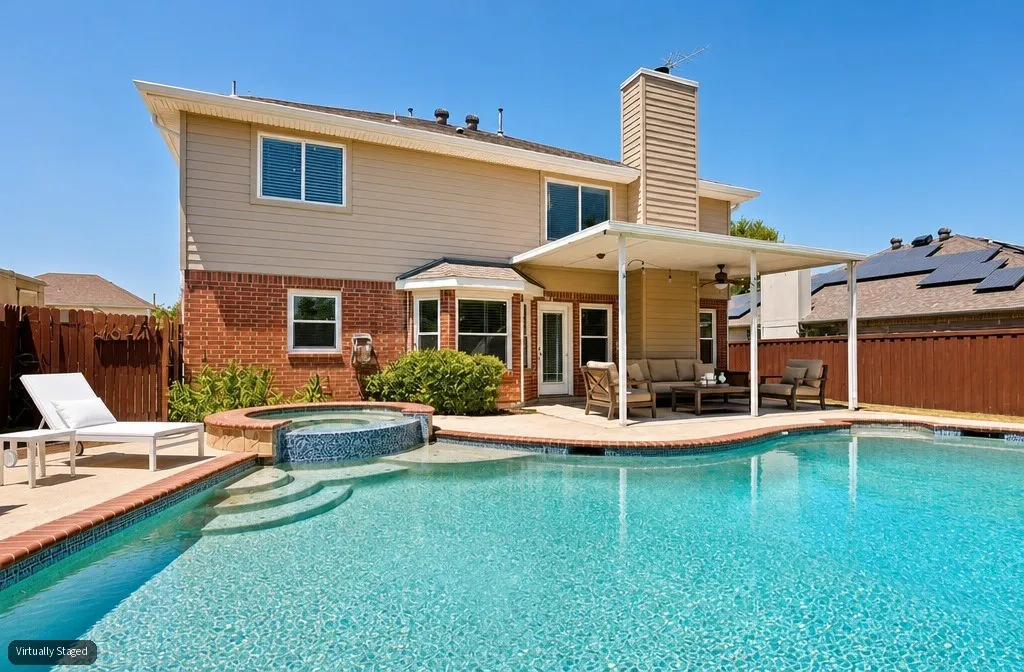 Beautiful heated pool and spa create the ultimate backyard retreat, complete with a diving board and slide for endless summer fun and entertaining.