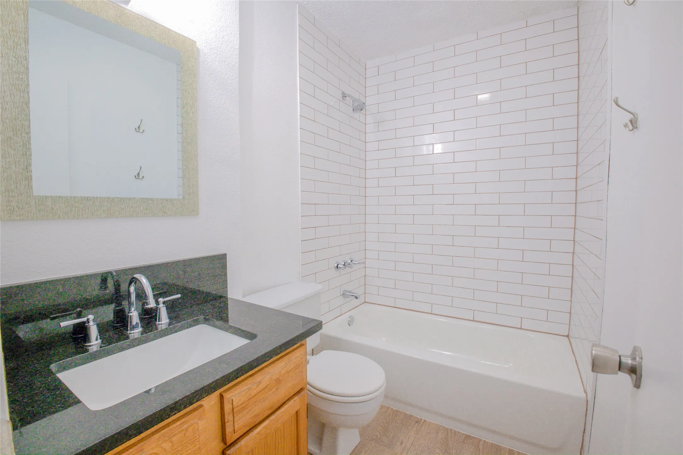 White subway tile tub surround