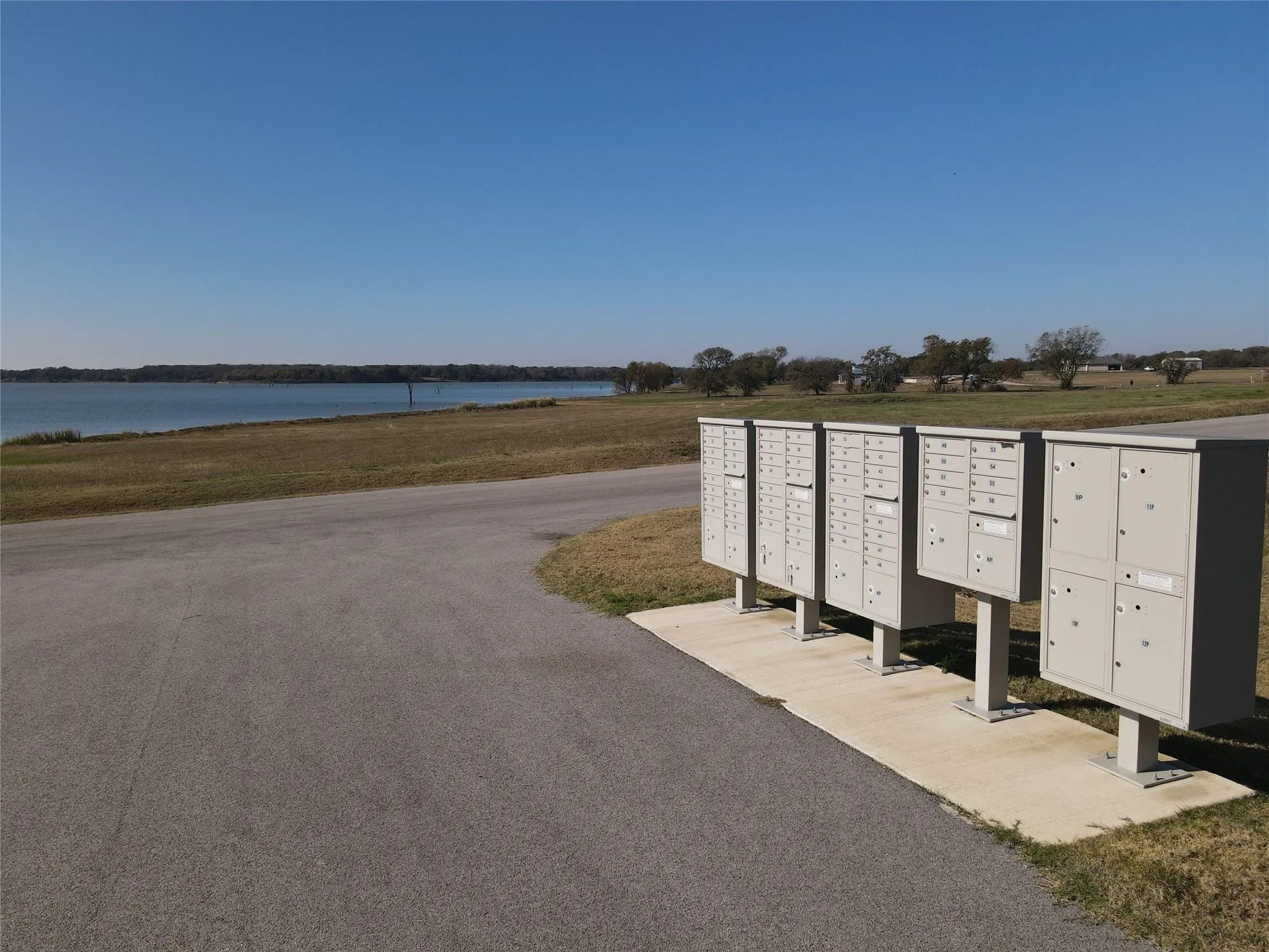 Community mailboxes with a waterfront backdrop