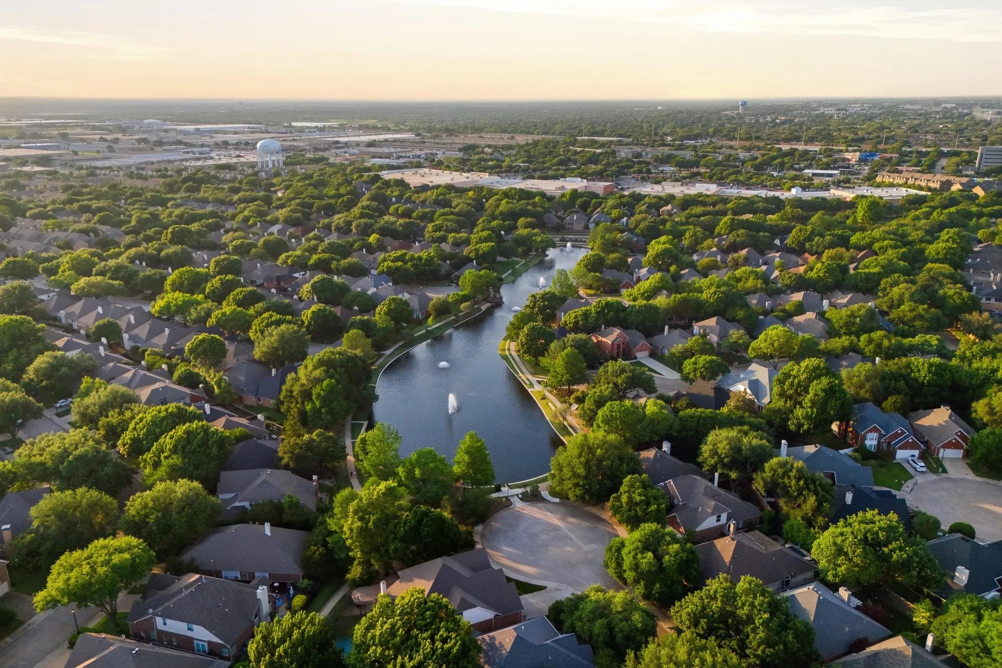 Les Lacs Pond — a serene neighborhood pond with fountains and lush green surroundings, just a short 5-minute walk from home.