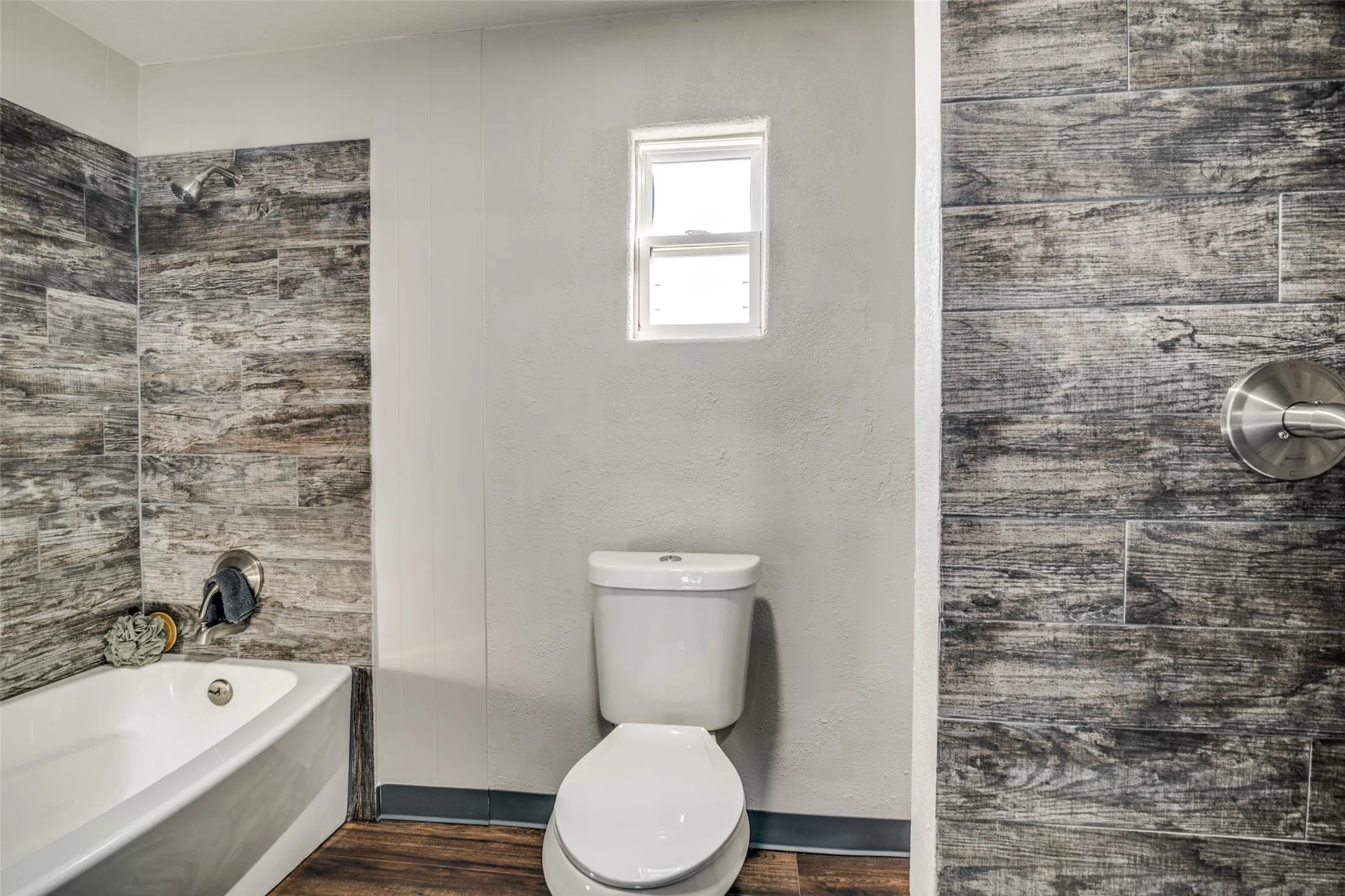 master bathroom with tile surrounds and brushed nickle fixtures.