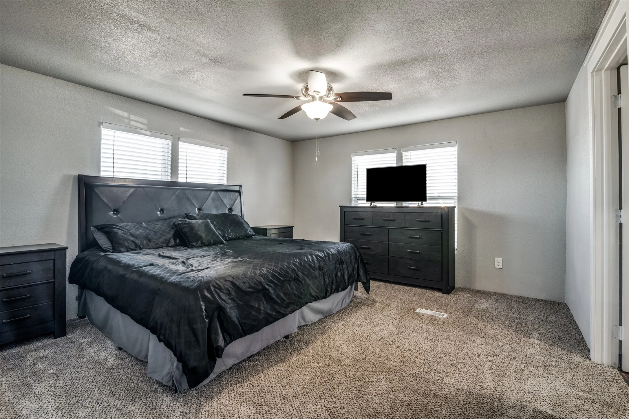 Master bedroom with king size bed.