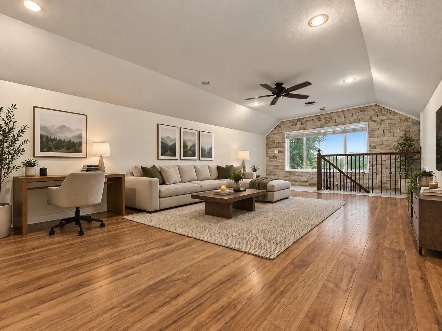 Vaulted ceilings with recessed lighting and a ceiling fan, wood-finish flooring, and a stone accent wall
