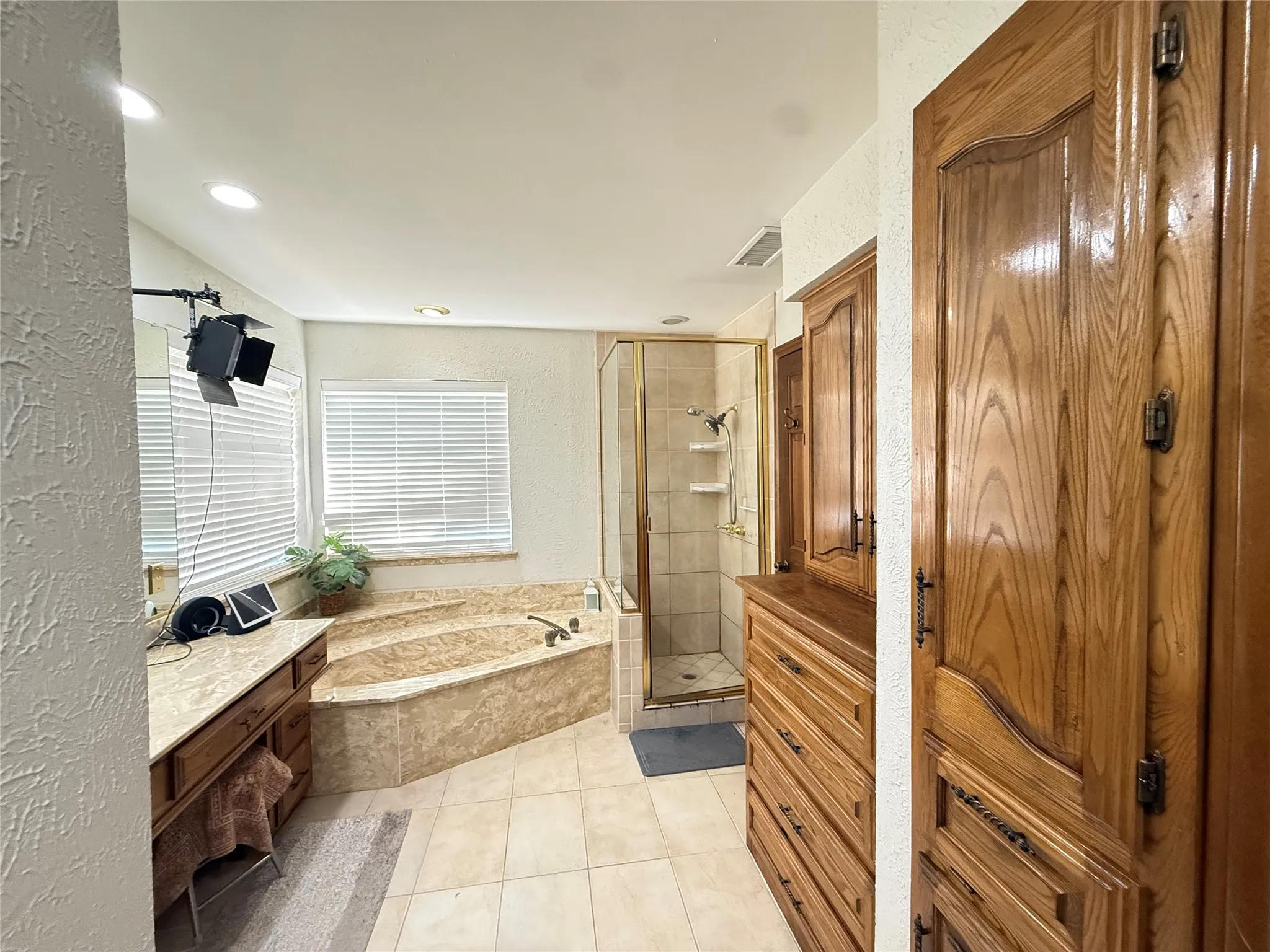 Bathroom with vanity and storage