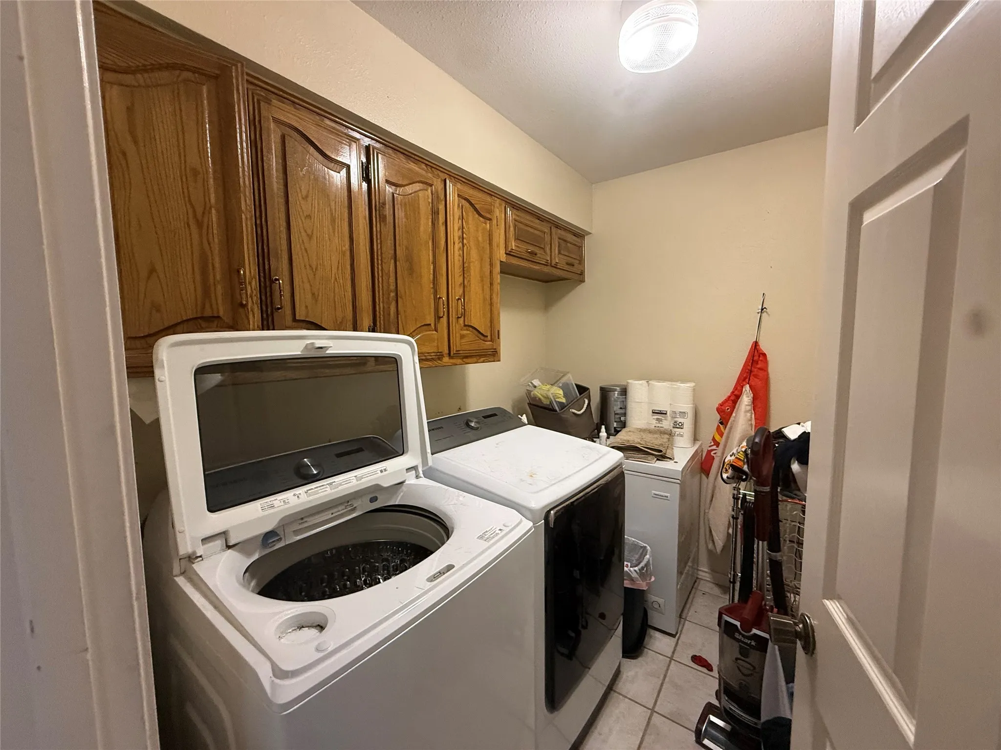 Laundry room with cabinet storage