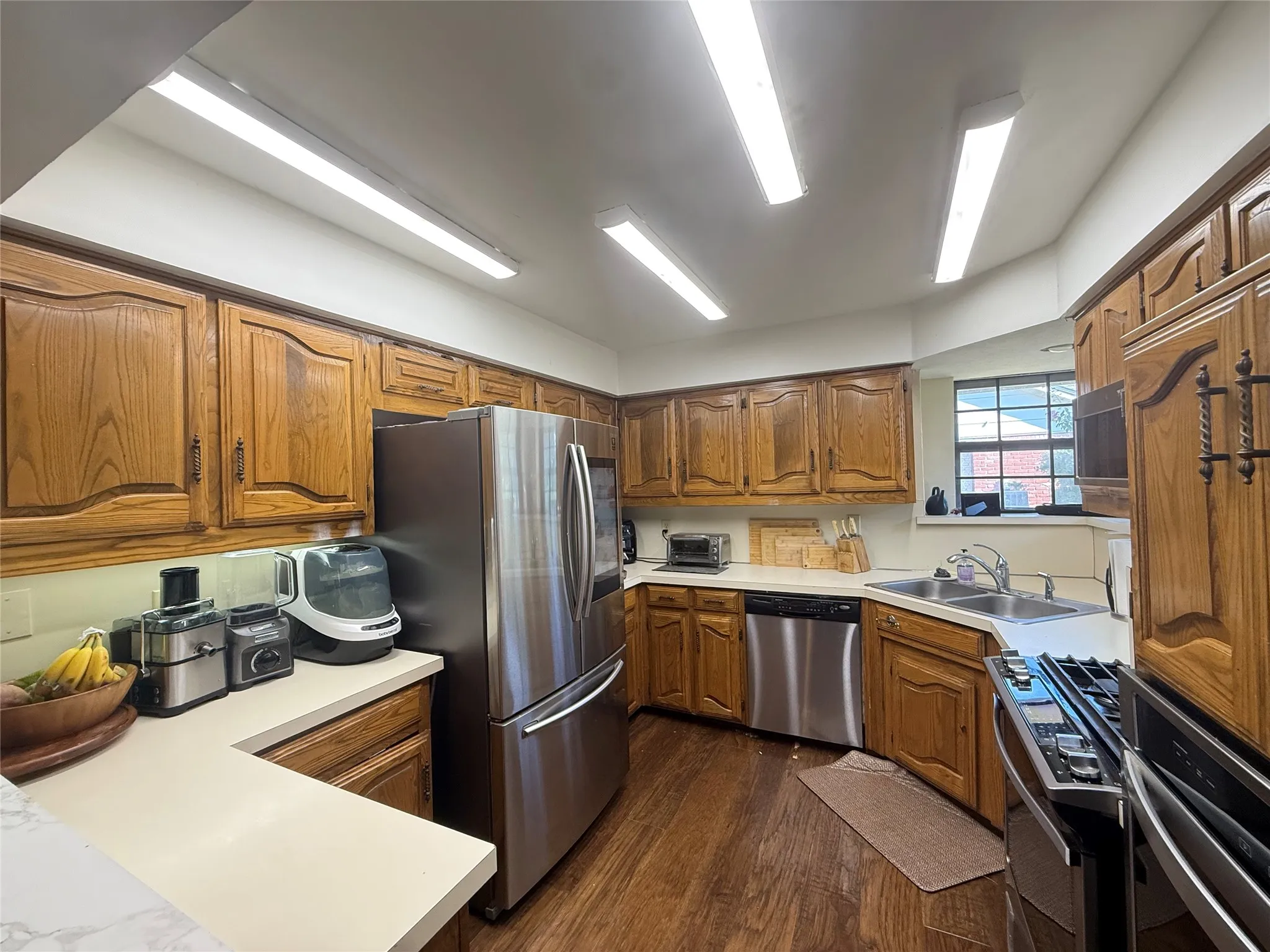 Kitchen view toward breakfast area