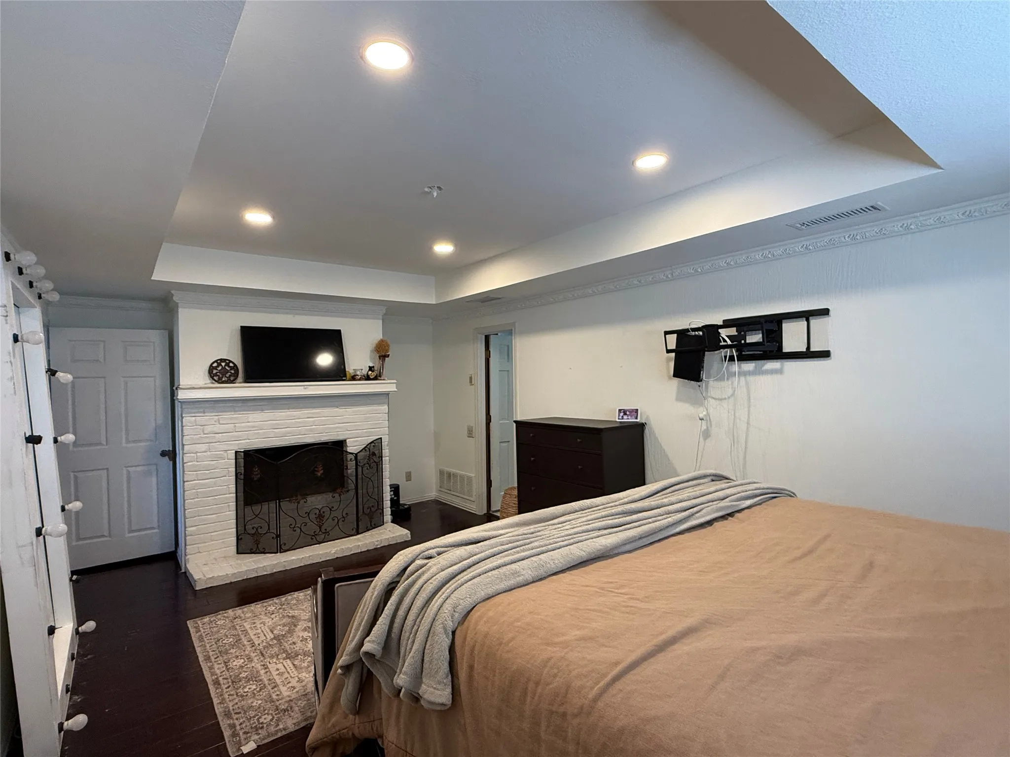Bedroom with wall mounted television