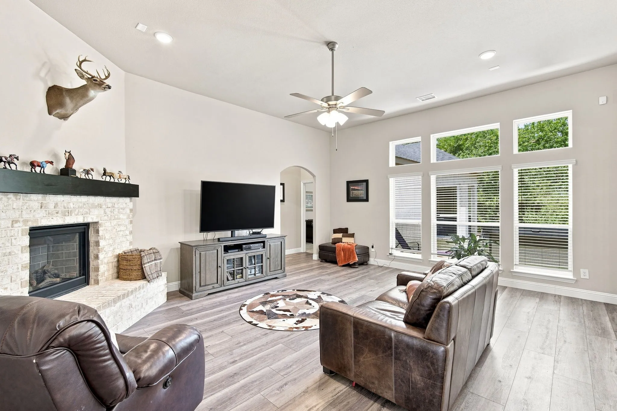 Great room features multiple picture windows