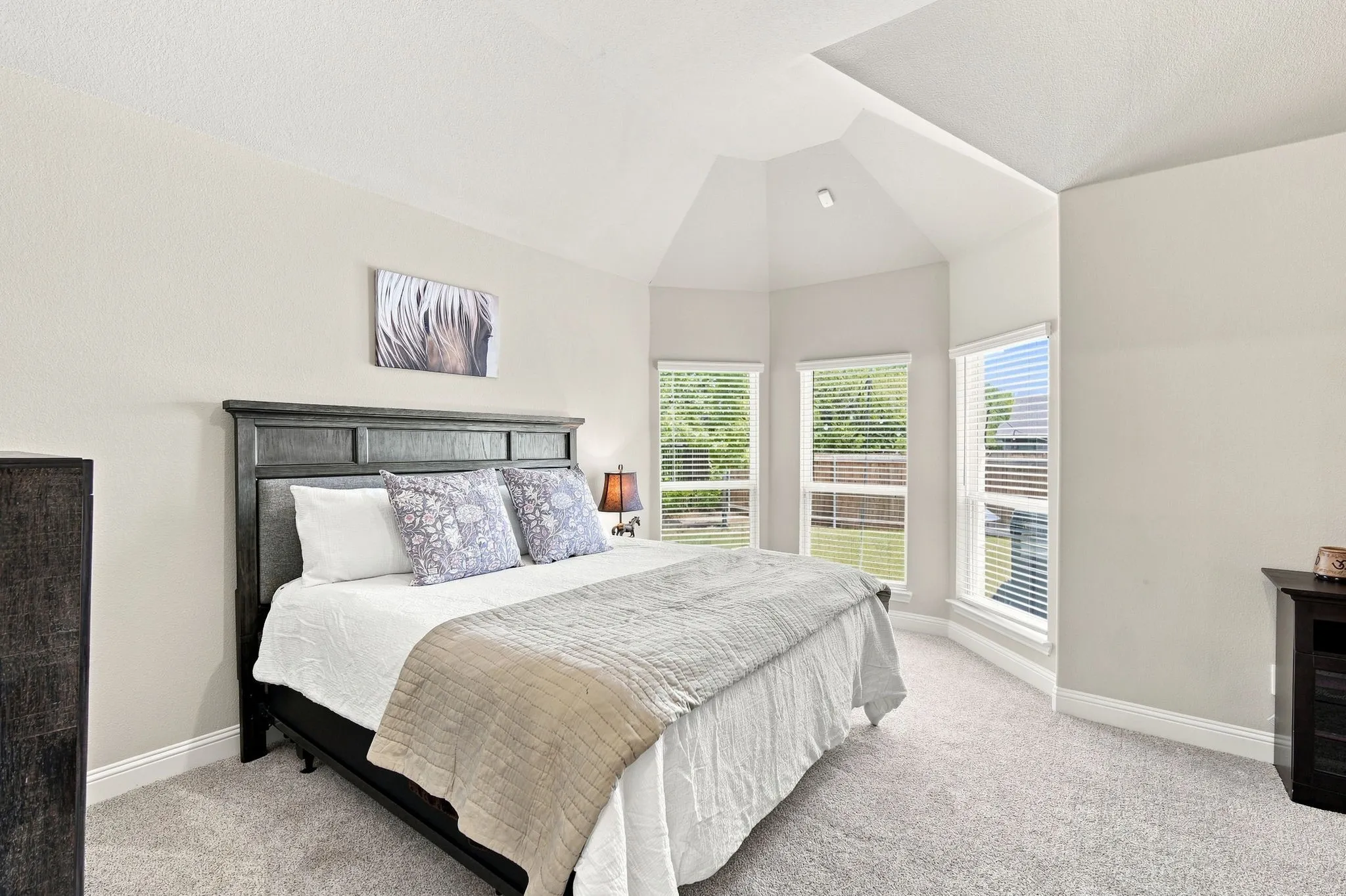 Bay window in primary. Architectural loft ceiling