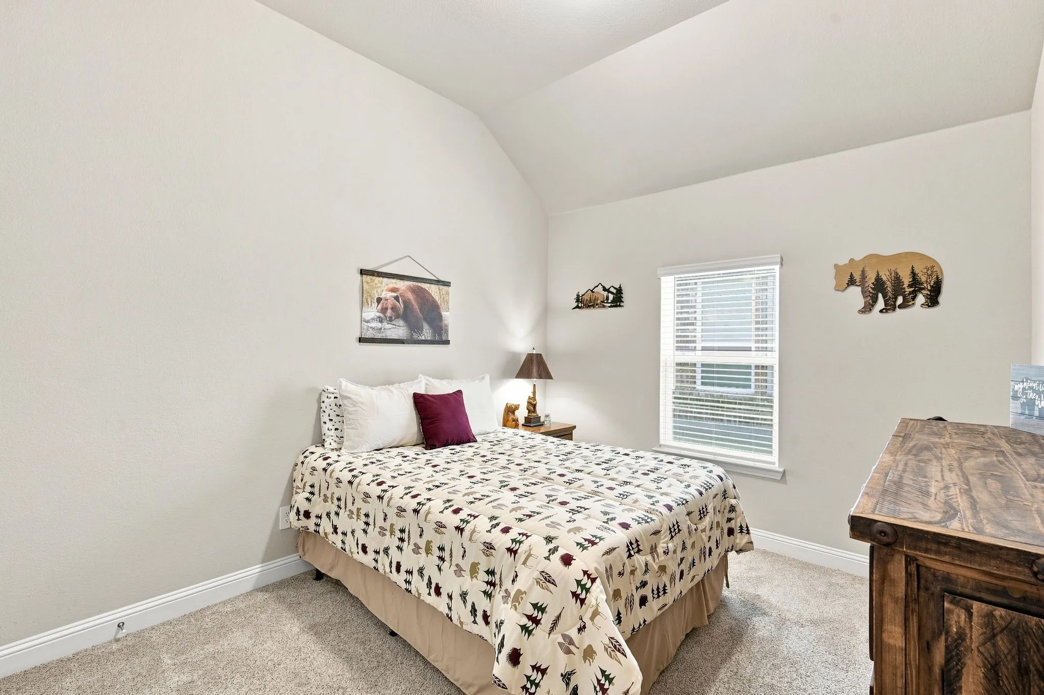 Guest bedroom with vaulted ceiling
