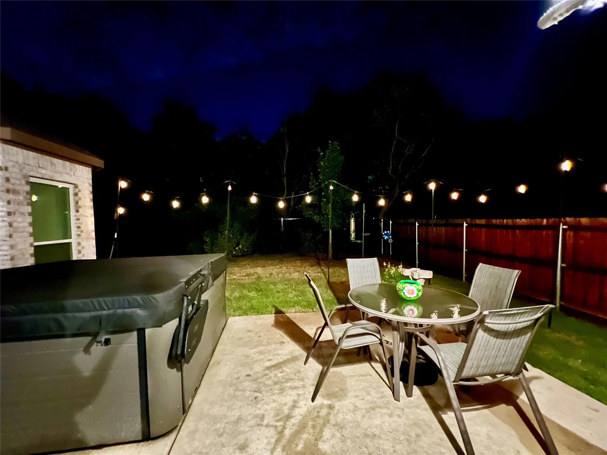 Patio has room for seating beside hot tub
