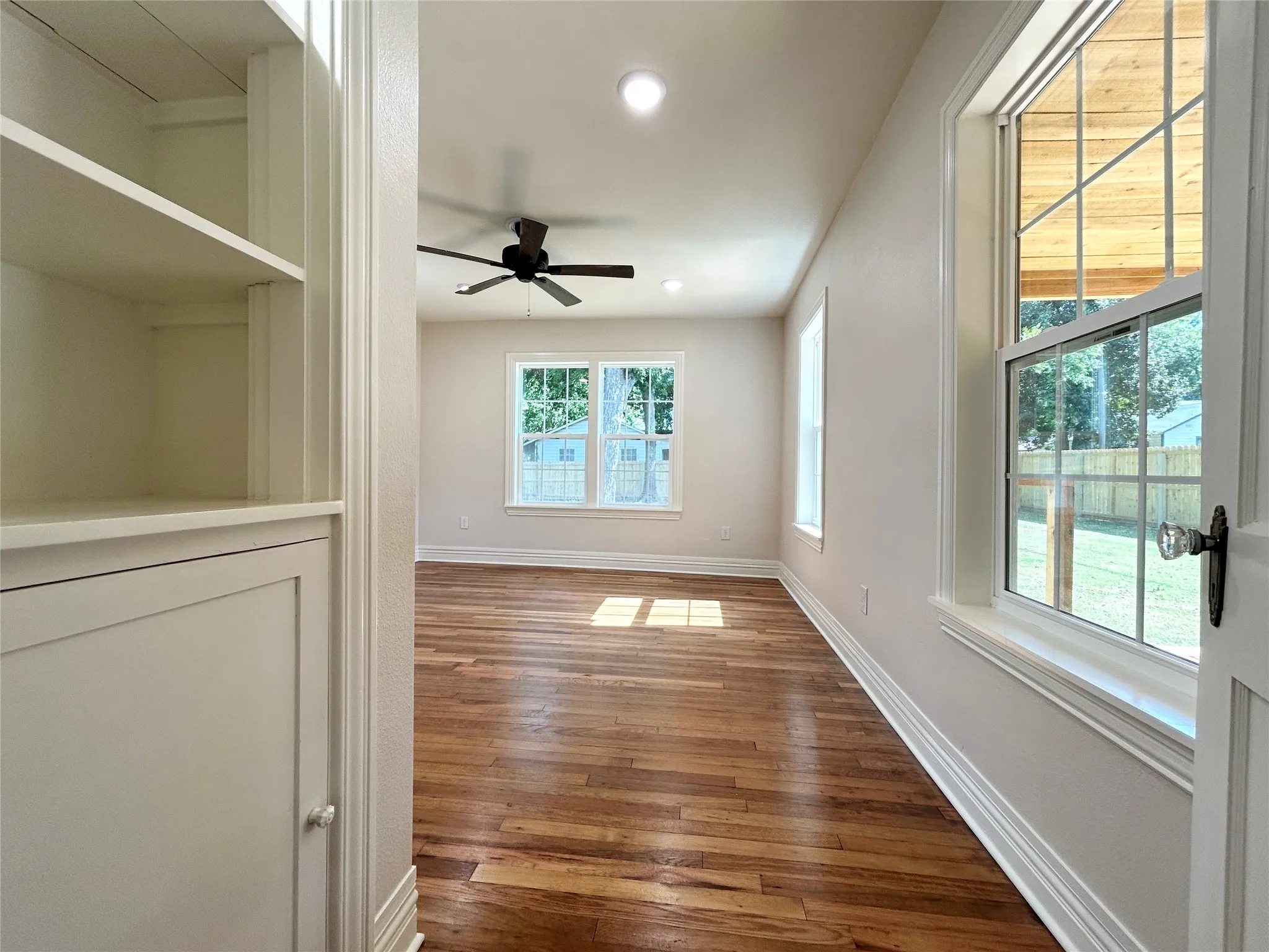 Unique built ins with orginal hardwood and natural light make this home a charmer