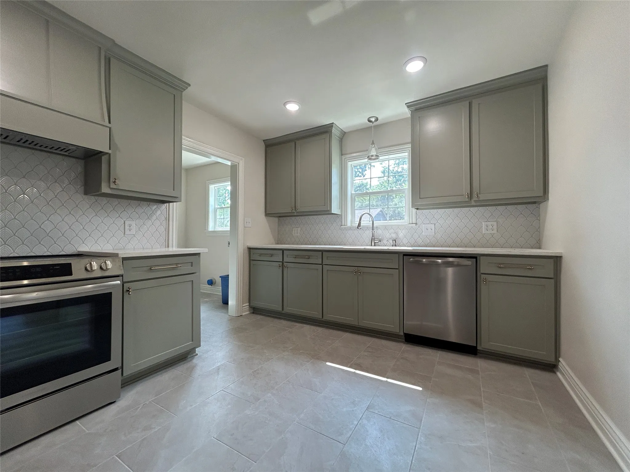 New appliances including dishwasher, electric range, and venthood