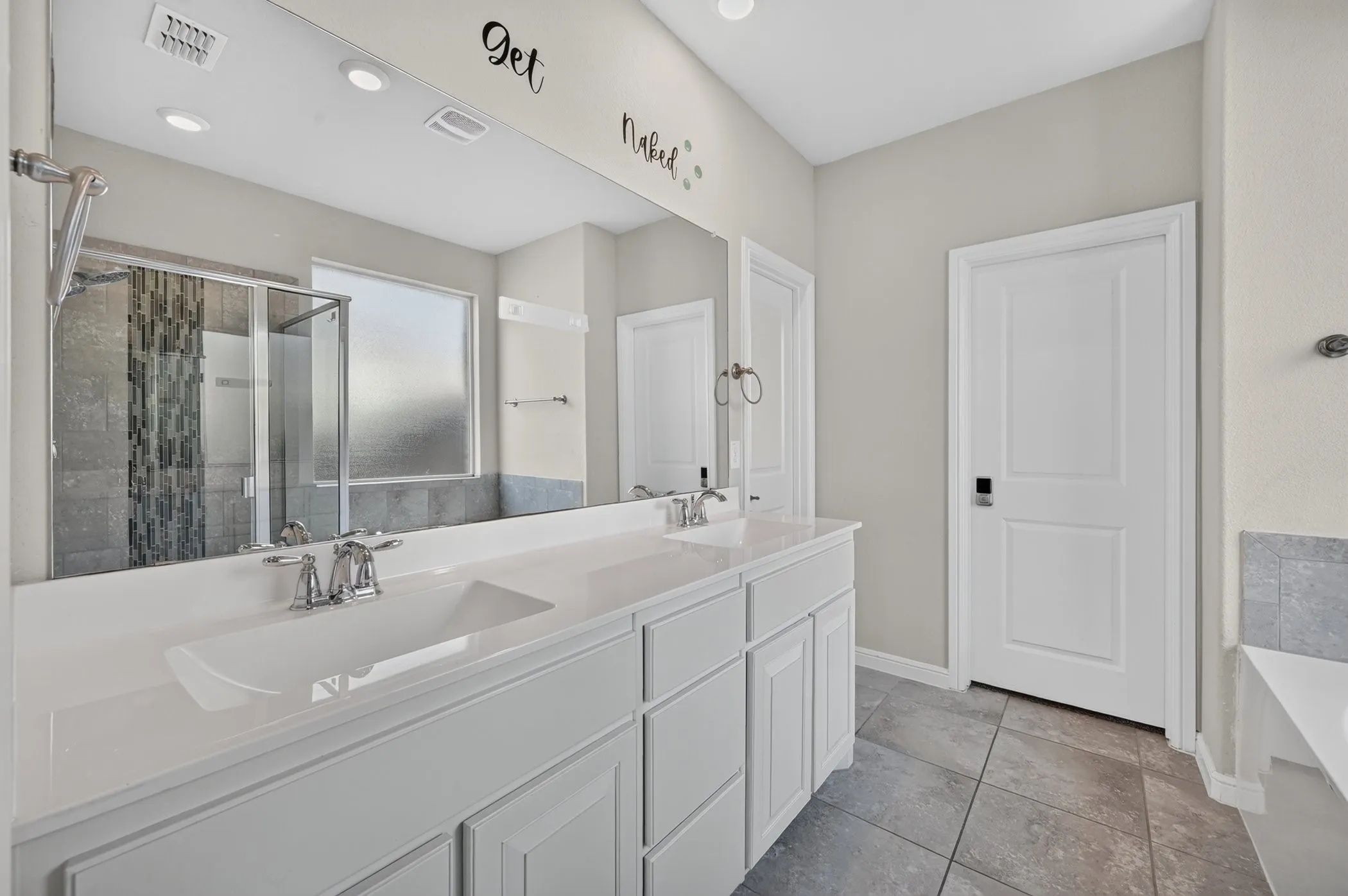 Dual vanity with integrated sinks and chrome fixtures
