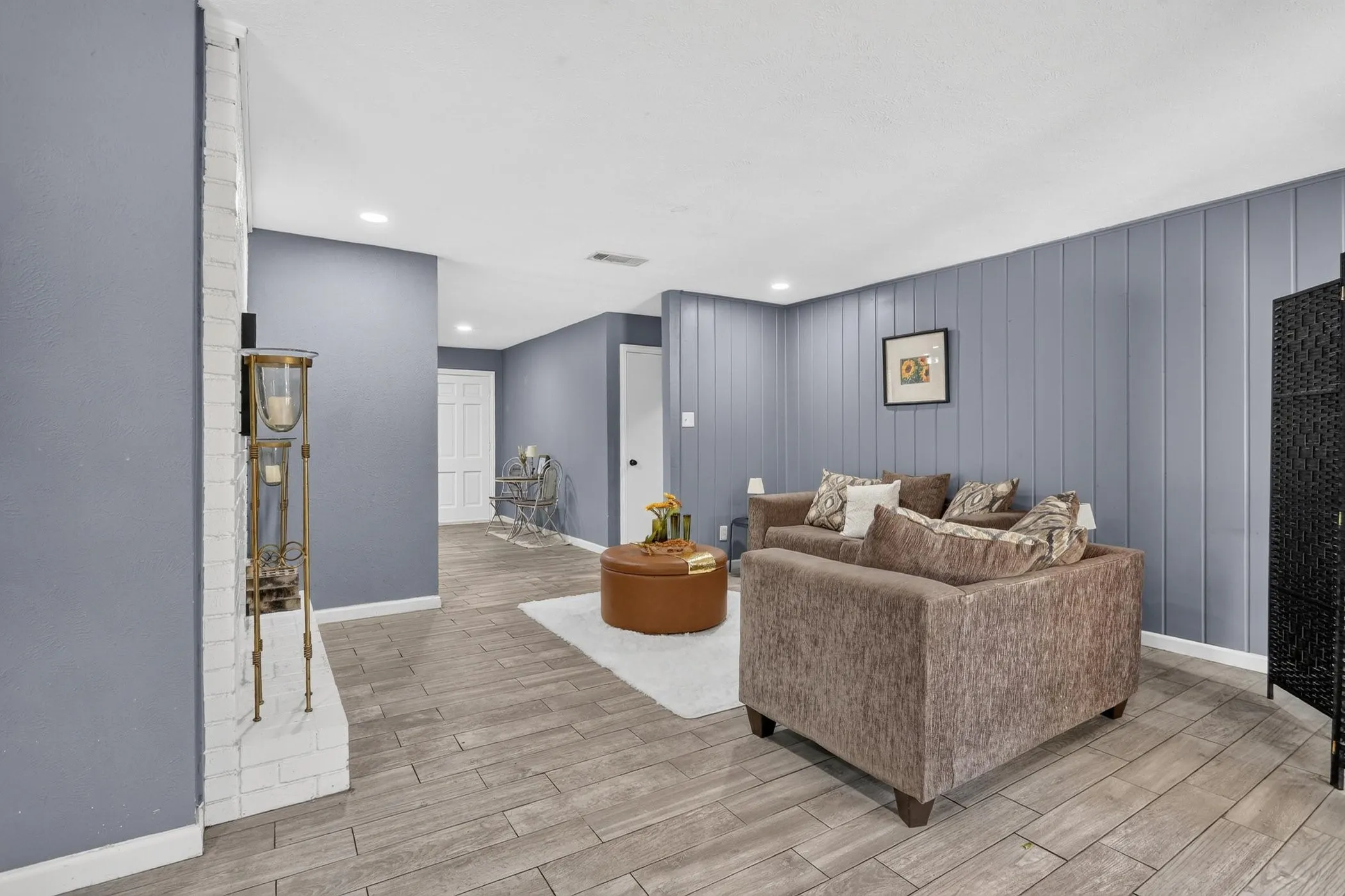 Wood-finish flooring throughout the space