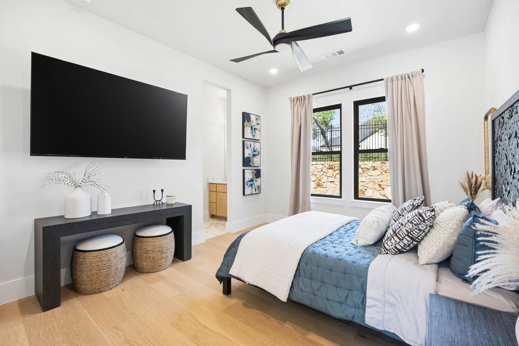 Downstairs guest suite connects to bathroom with two sinks and the entertainment room, so it could make an excellent inlaw suite!