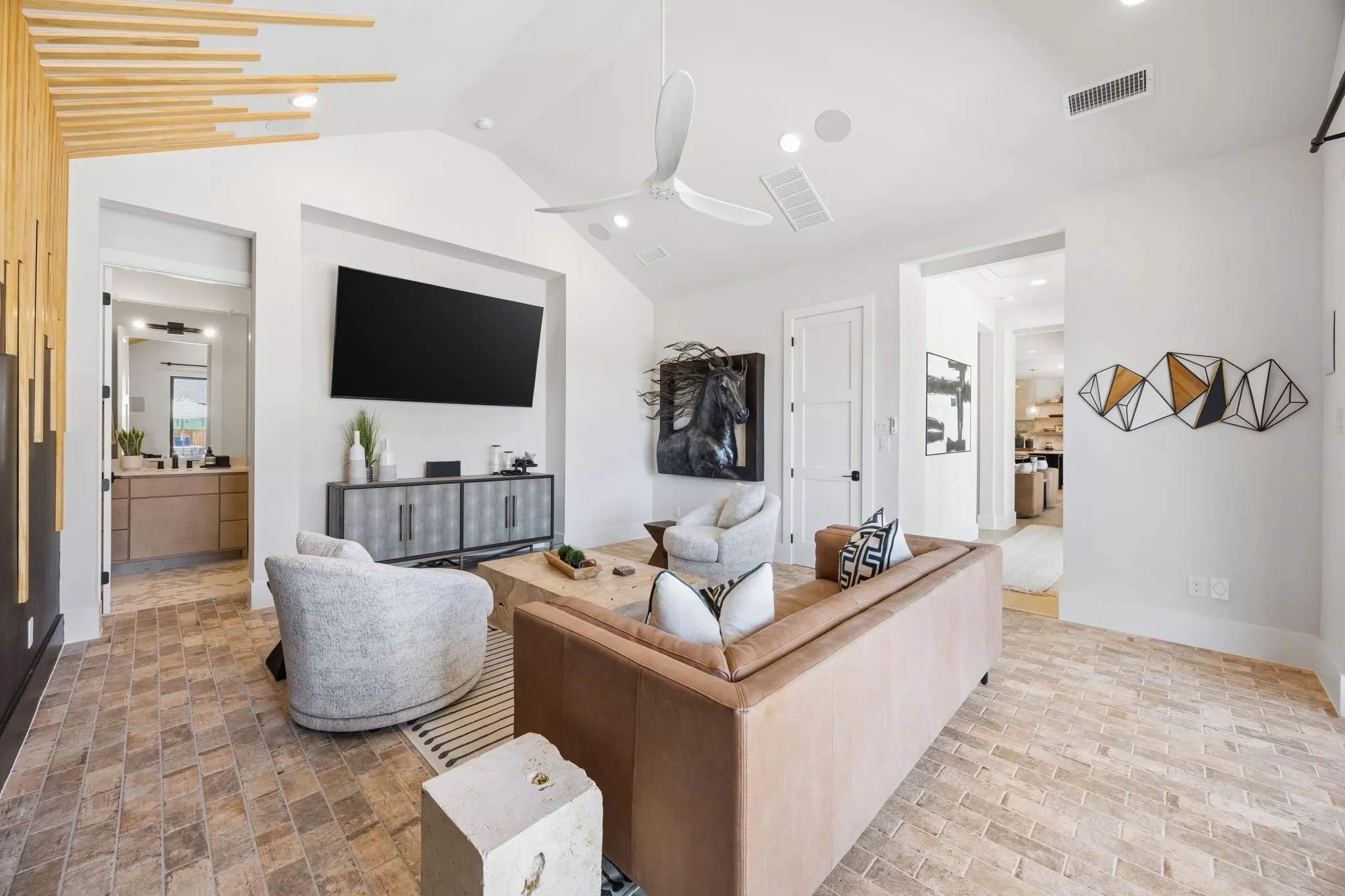Downstairs entertaining room has 9 ft sliding doors that open onto the covered patio with outdoor kitchen.
