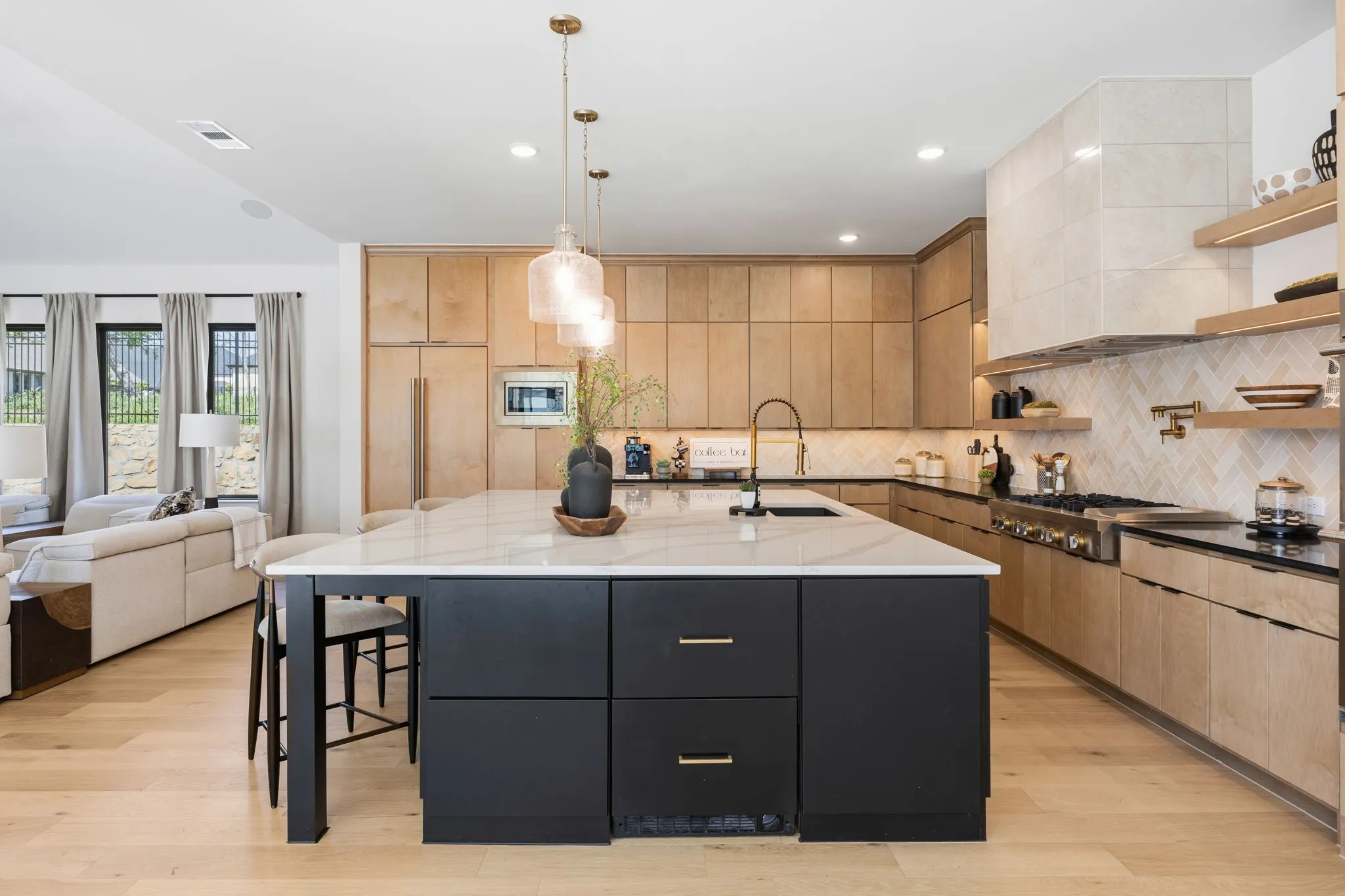 Refrigerated drawer and freezer drawer with ice, built into the custom island.