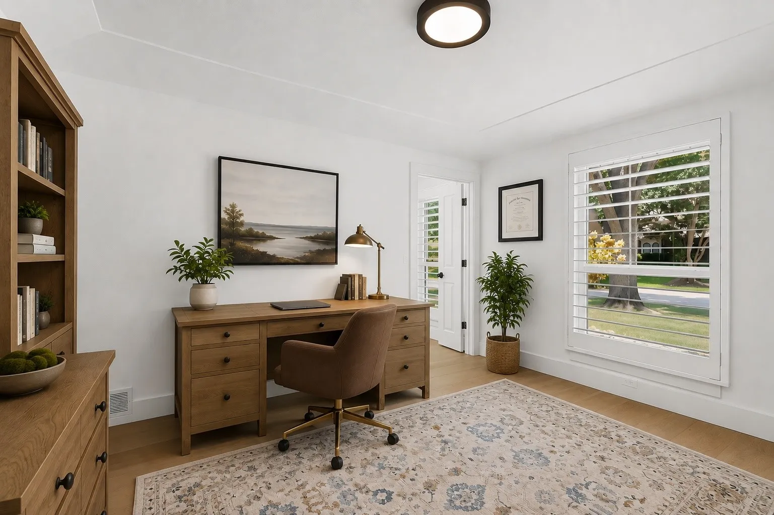 Recessed ceiling light fixture, wood-finish flooring, white plantation shutters,  and a solid-core interior door