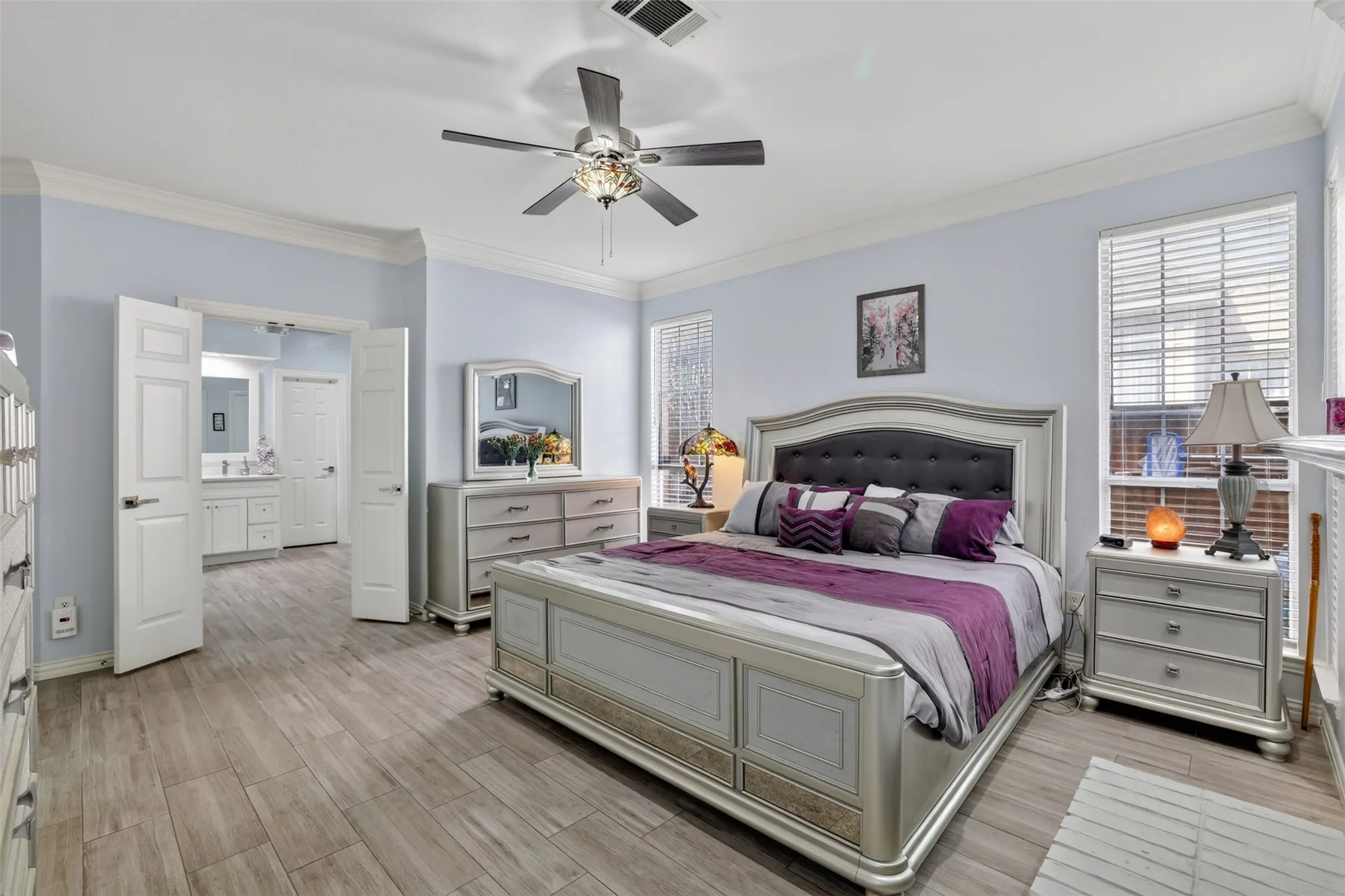Primary bedroom has 2 Walkin closets and French doors open to the primary bath.