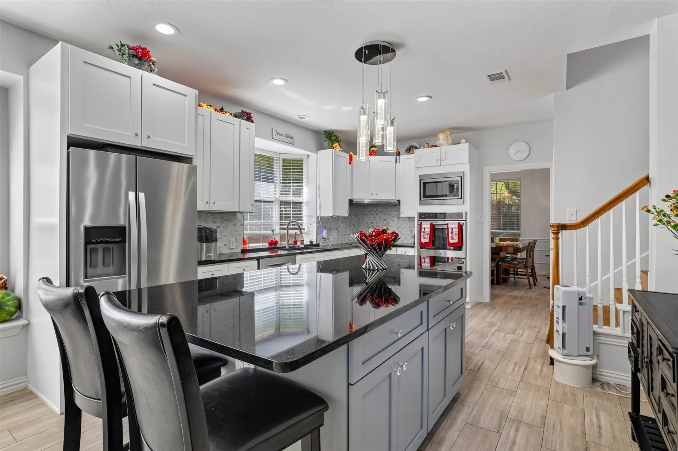 Enjoy uninterrupted workspace on the expansive granite island, ideal for cooking, serving, homework, or gathering with family and friends.