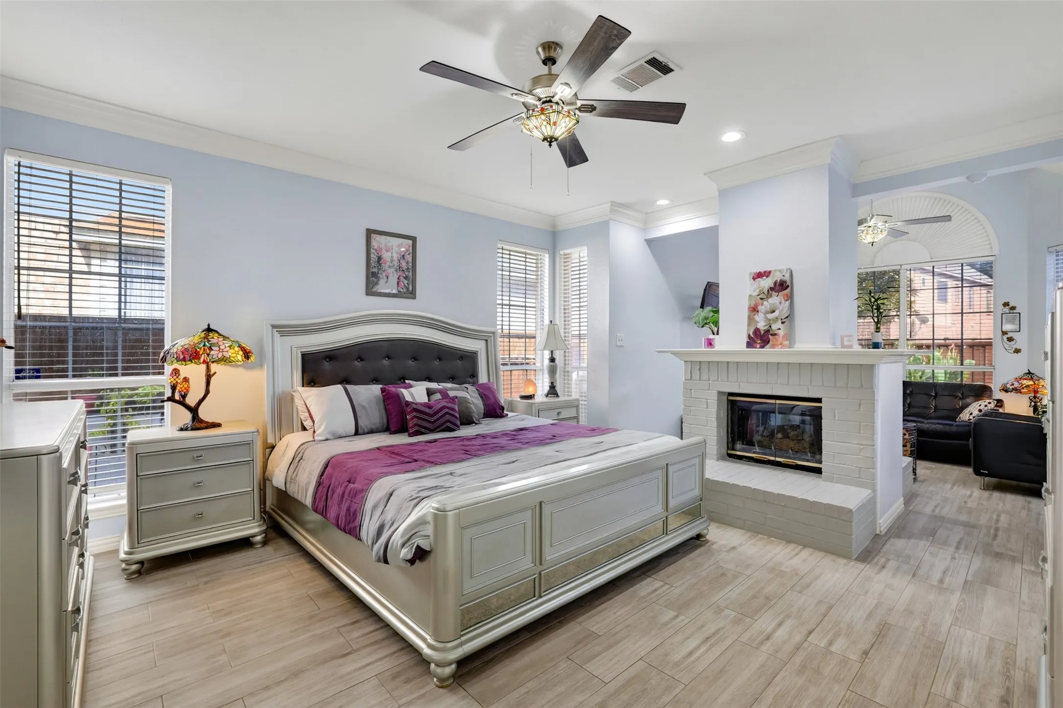 Expansive primary bedroom with a lovely fireplace for those cozy winter nights.