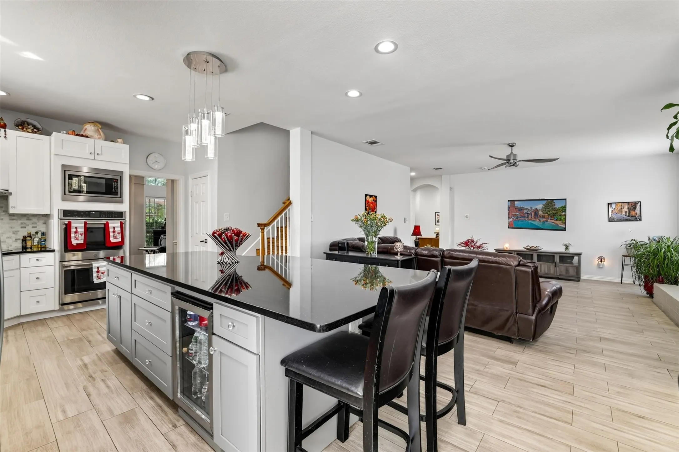 Entertain with ease around the oversized granite island complete with a built-in beverage refrigerator and ample seating.