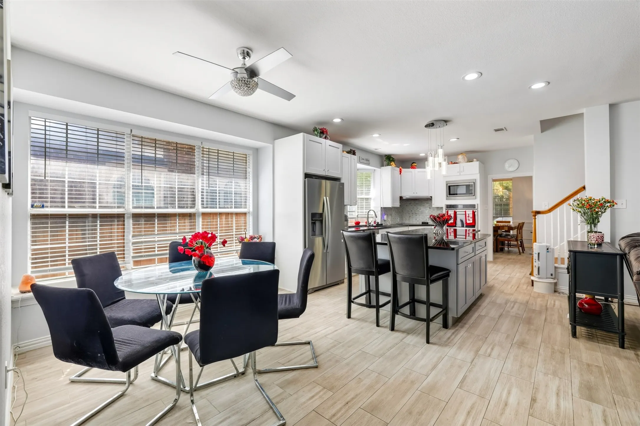 Huge eating area off of the beautiful kitchen with second stairway to the upstairs.
