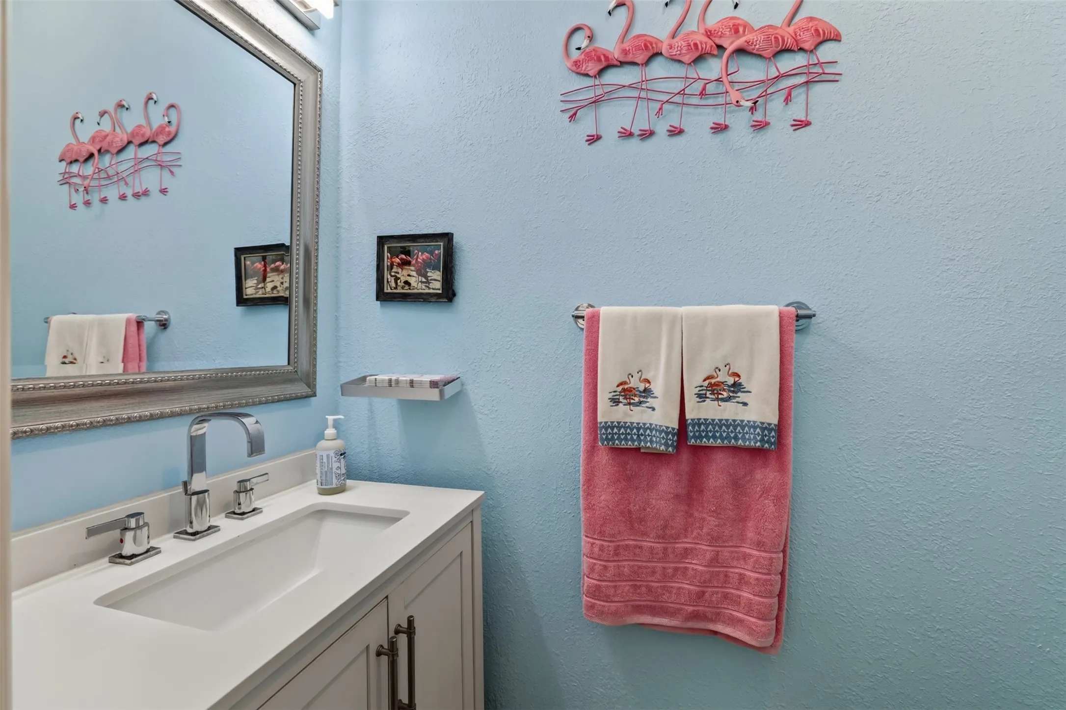 Conveniently located half bath near the backyard entrance, making pool days easy and keeping wet feet out of the main living areas.