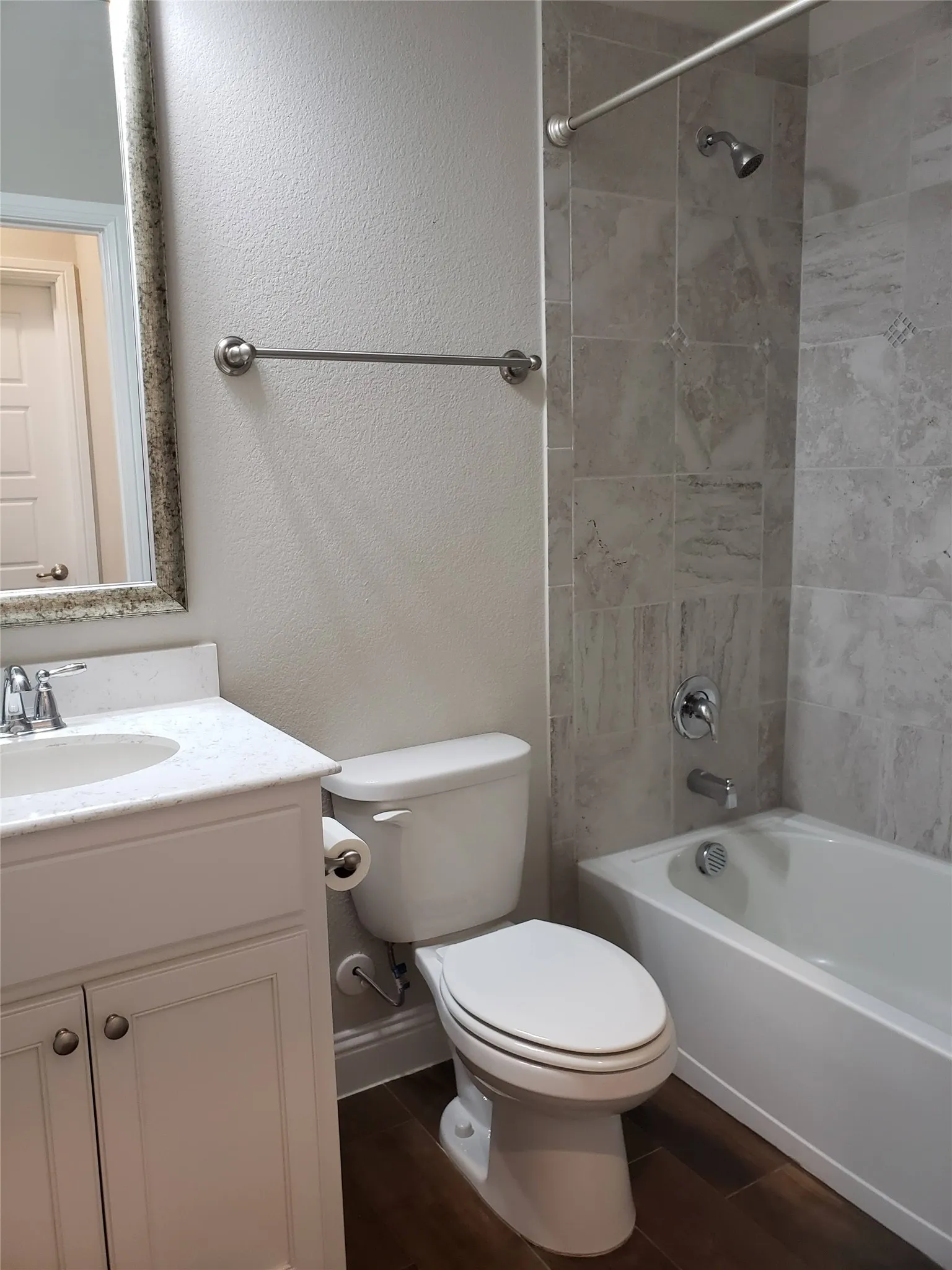 2nd bath with White vanity with a single basin sink and stainless steel faucet