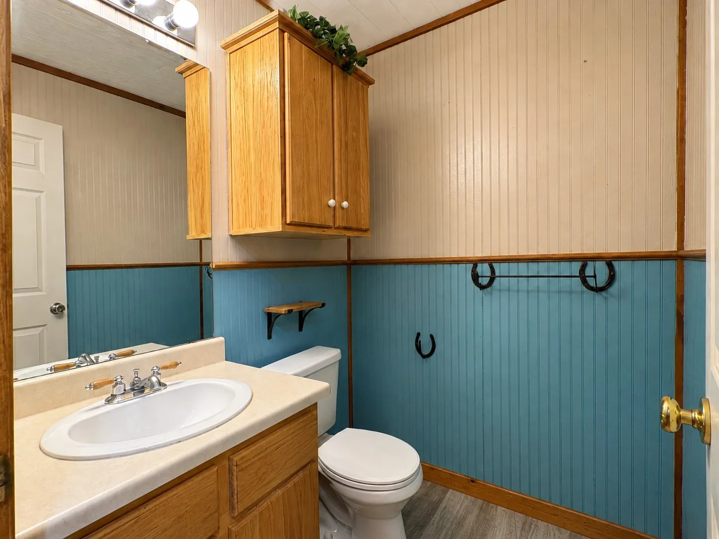 Bathroom vanity with an oval sink, chrome faucet, and integrated countertop
