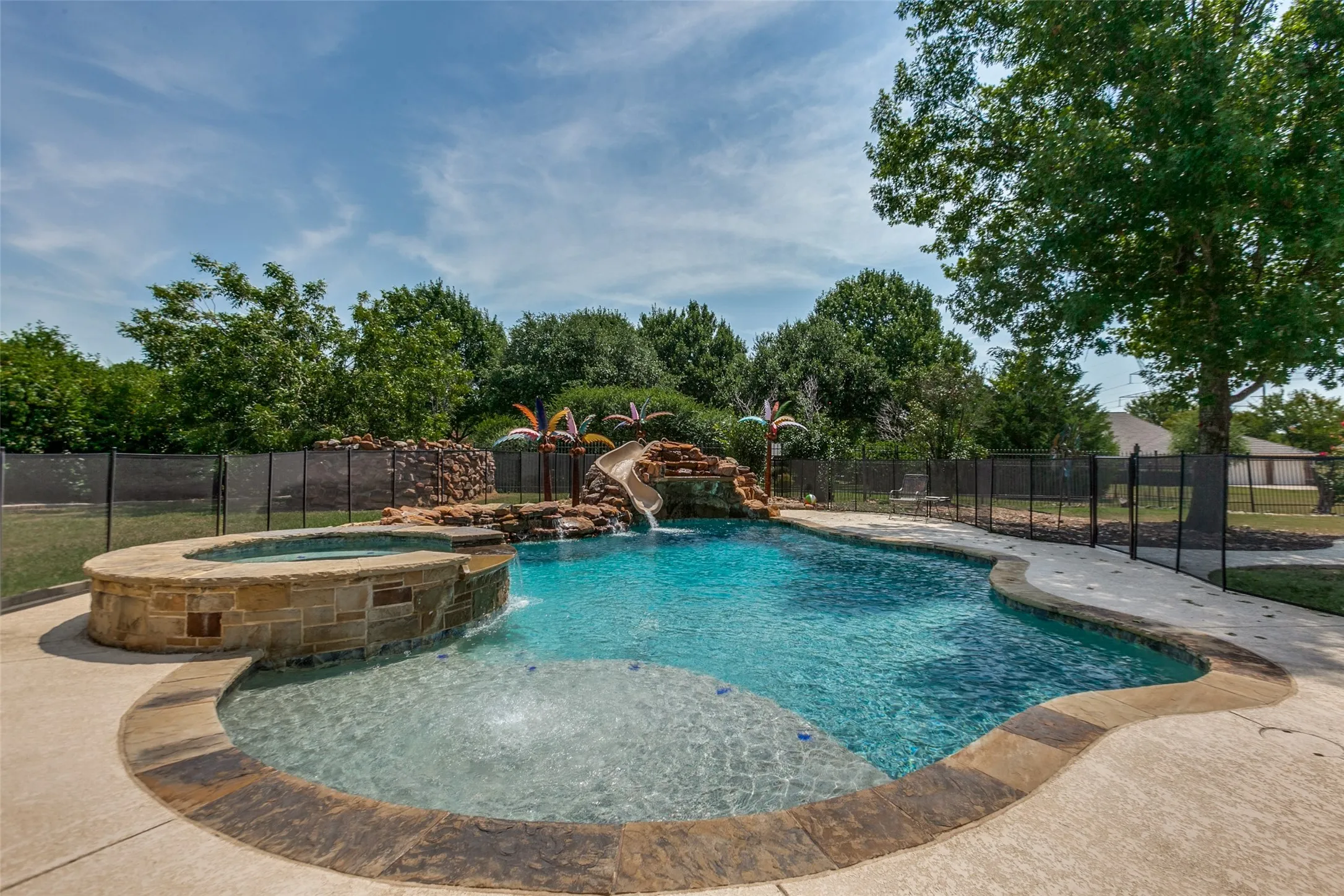 Beautiful Pool with sundeck and hot tub and a slide for the little ones