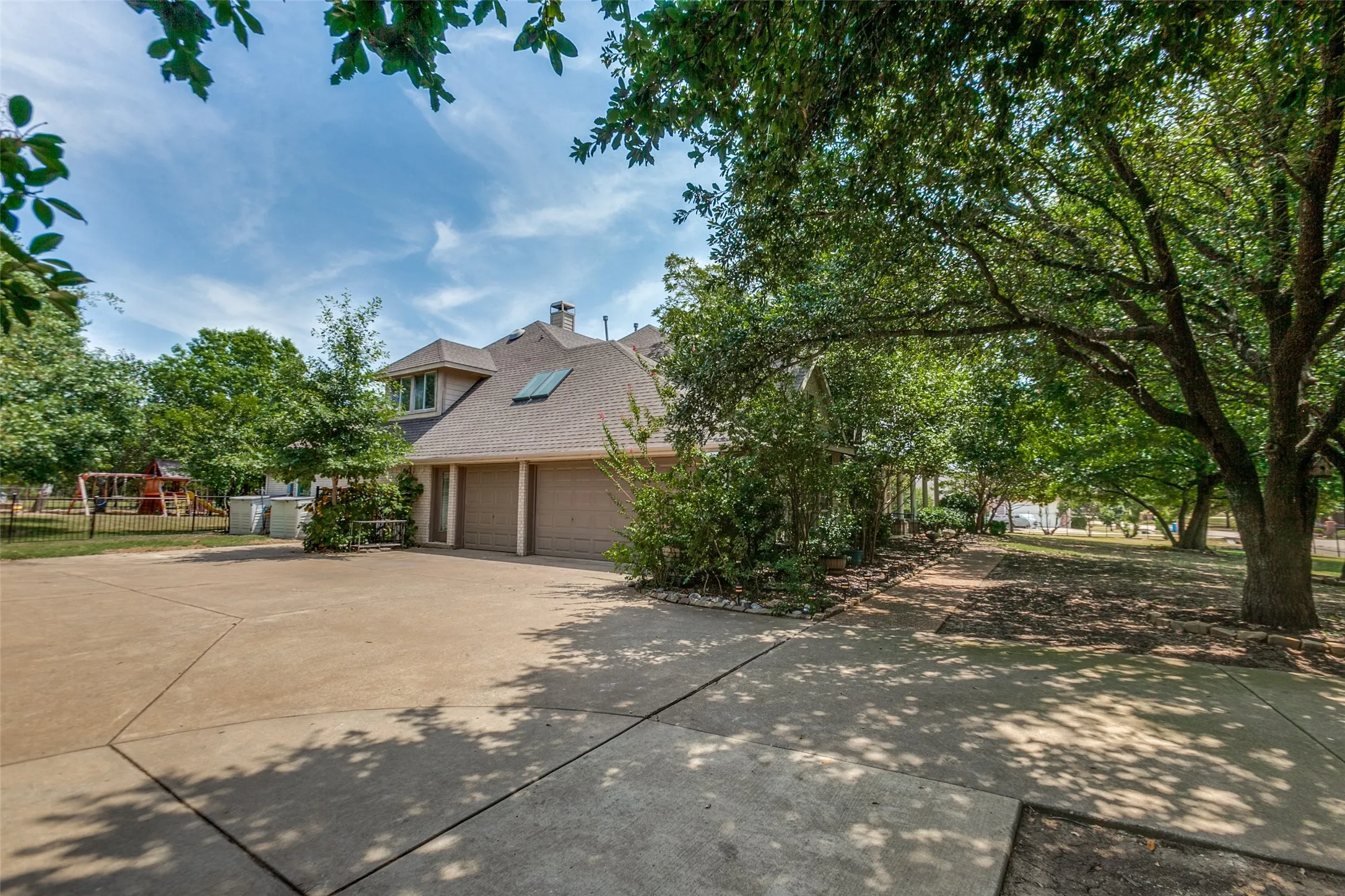 Freshly Painted 3 car garage with large driveway