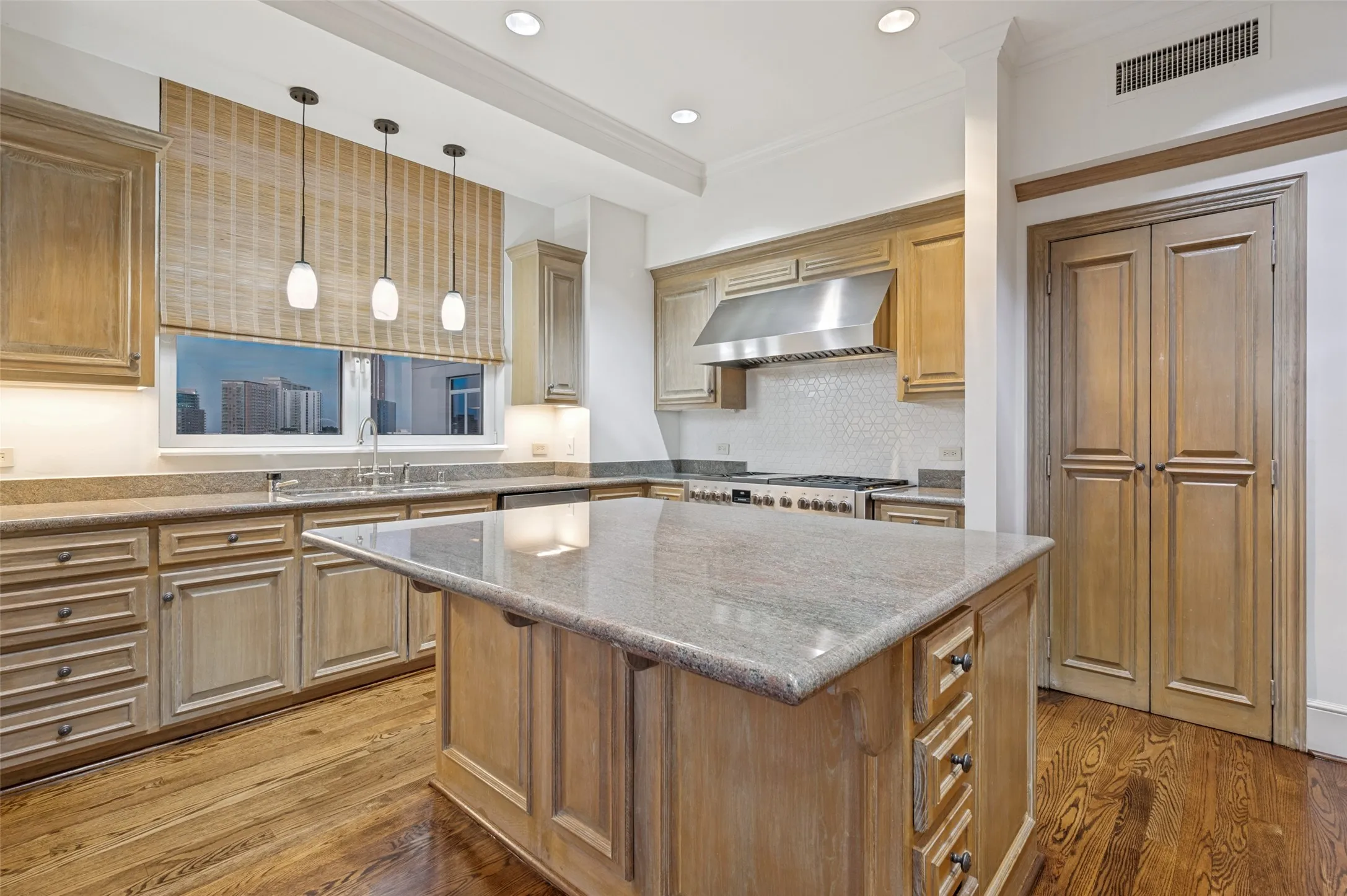 Bright and light from two sides in the spacious kitchen with plenty of counter top space.